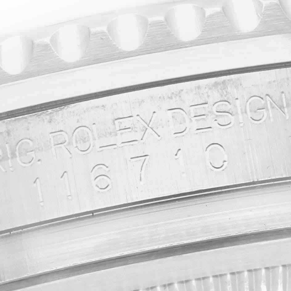 The image shows a close-up of the watch case inscription with the serial number and edge details for a Rolex GMT-Master 116710 Men
s Stainless Steel Black Dial 116710 Men
s Stainless Steel Black Dial.