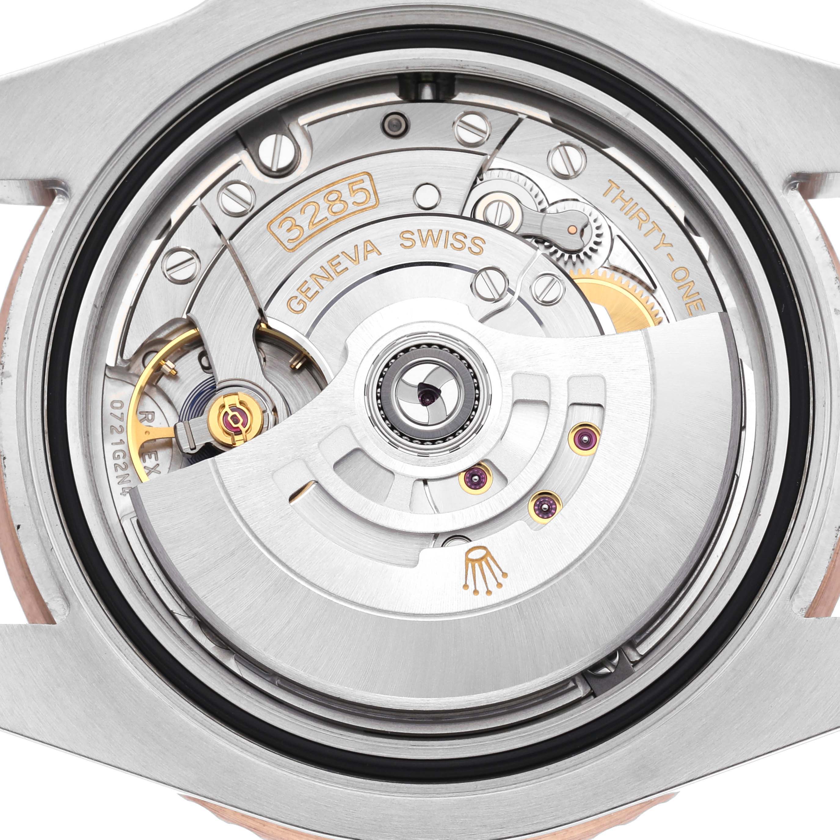 The image shows the movement mechanism of the Rolex GMT-Master 126711 Men
s Steel and Gold (two tone) Black Dial 126711 Men
s Steel and Gold (two tone) Black Dial, highlighting its rotor and intricate components.