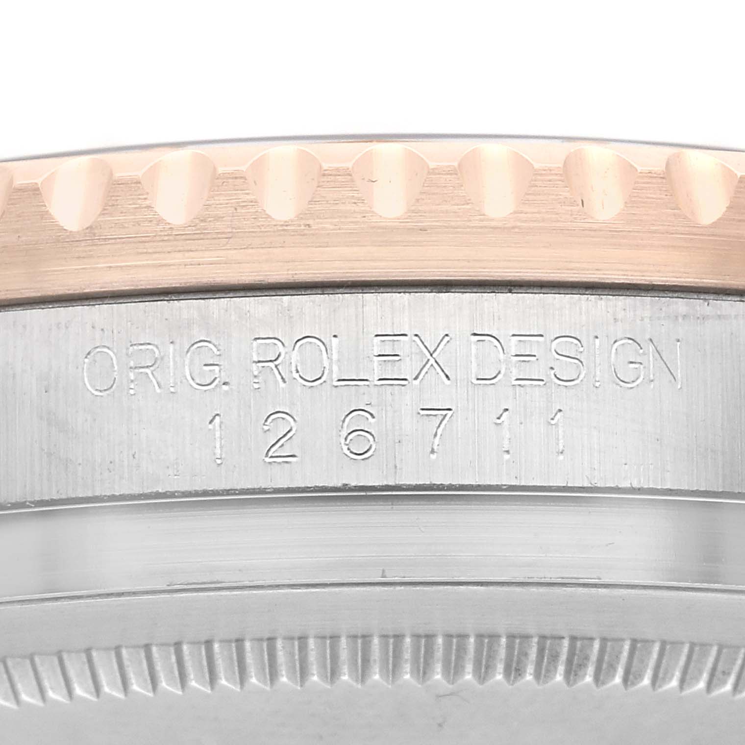 The image shows a close-up of the Rolex GMT-Master 126711 Men
s Steel and Gold (two tone) Black Dial 126711 Men
s Steel and Gold (two tone) Black Dial
s engraved case side, featuring model number 126711.