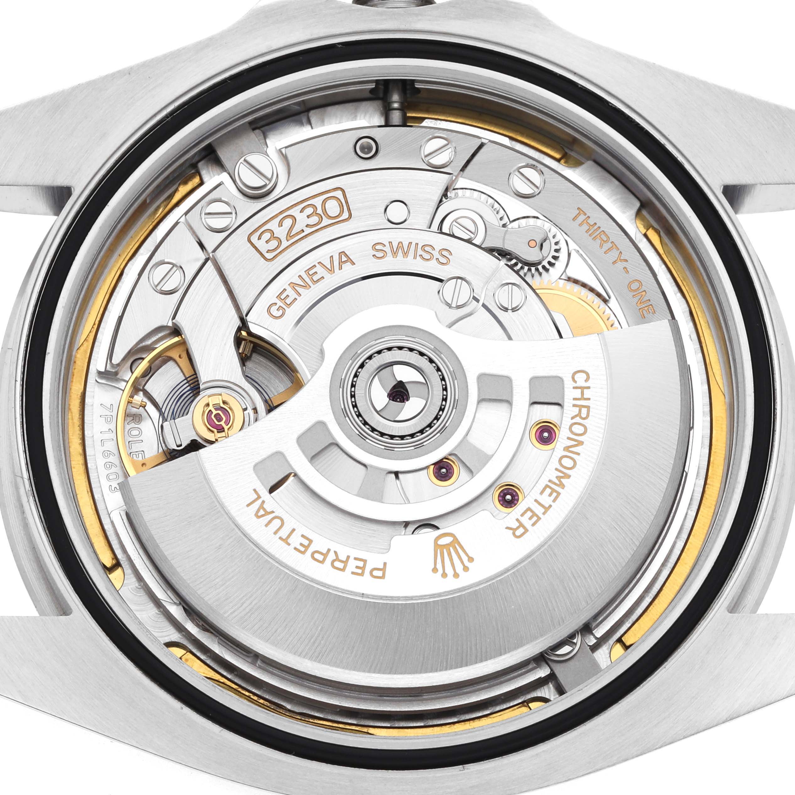 The image shows the Rolex Air-King 126900 Men's Stainless Steel Black Dial's movement from the back, showcasing gears, rotors, and the "Perpetual" rotor.