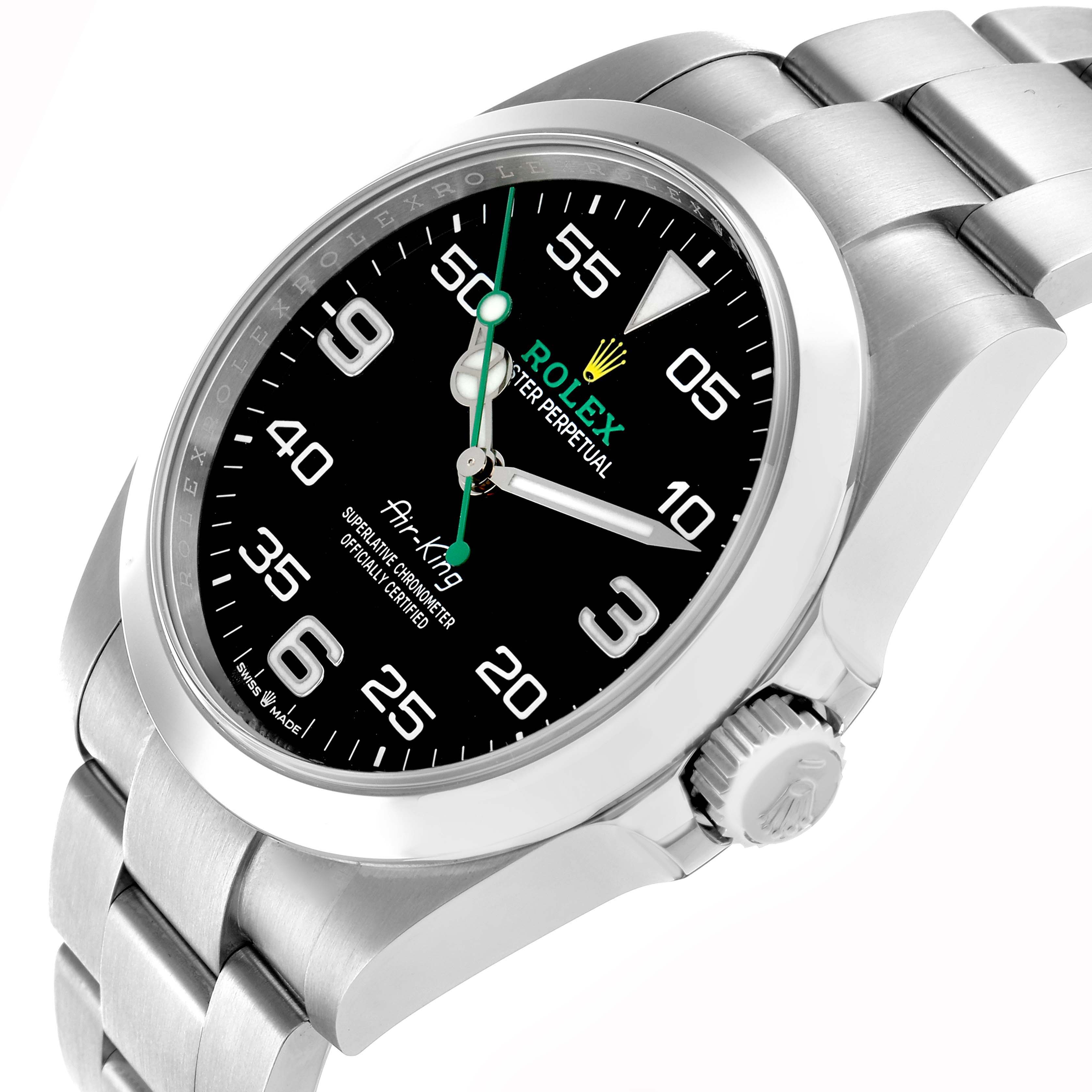 The Rolex Air-King 126900 Men's Stainless Steel Black Dial watch is shown at an angled side view, highlighting its black dial, bezel, crown, and stainless steel bracelet.