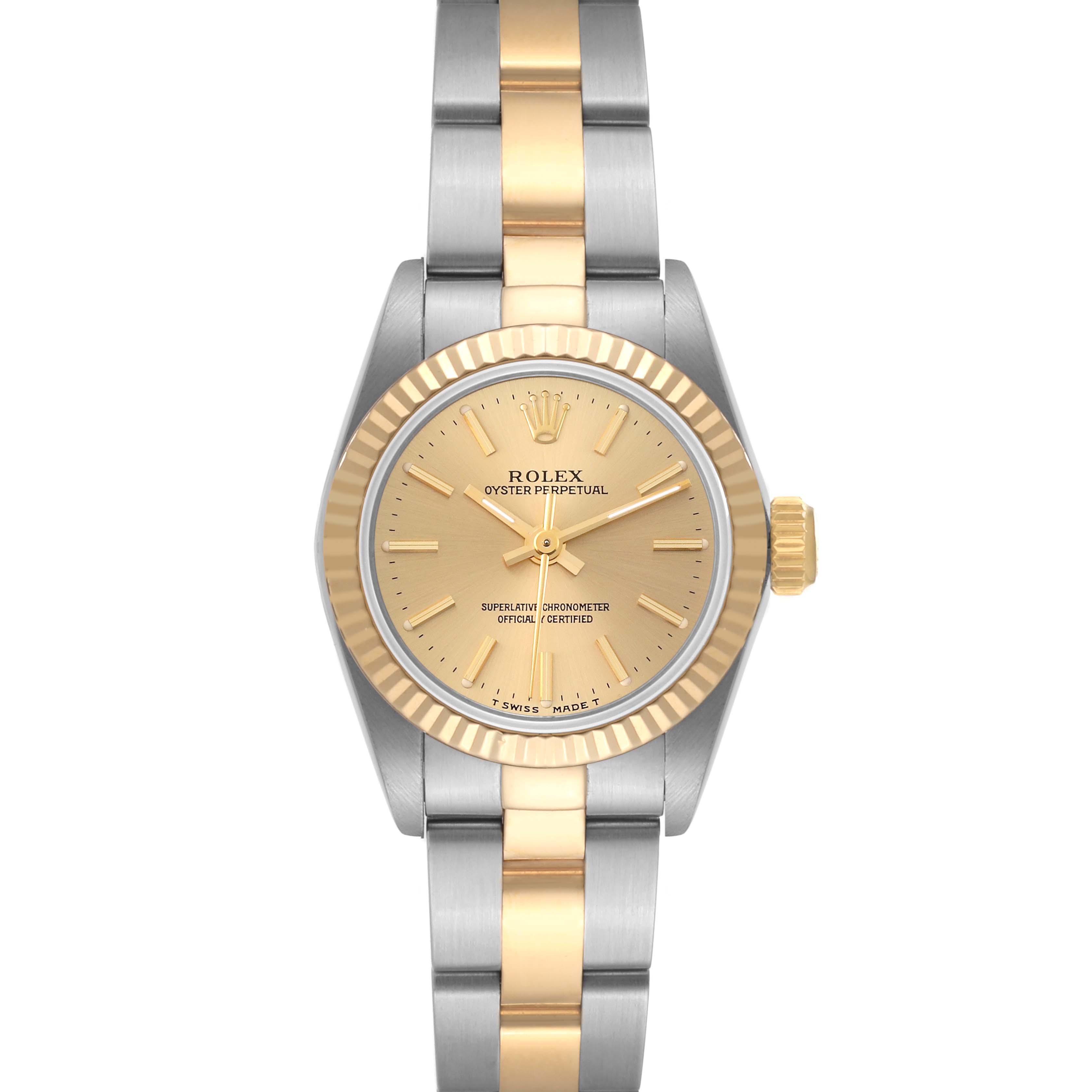 This Rolex Oyster Perpetual 67193 Women's Steel and Gold (two tone) Champagne Dial 67193 Women's Steel and Gold (two tone) Champagne Dial watch is viewed straight-on, showing its dial, bezel, crown, and two-tone bracelet.