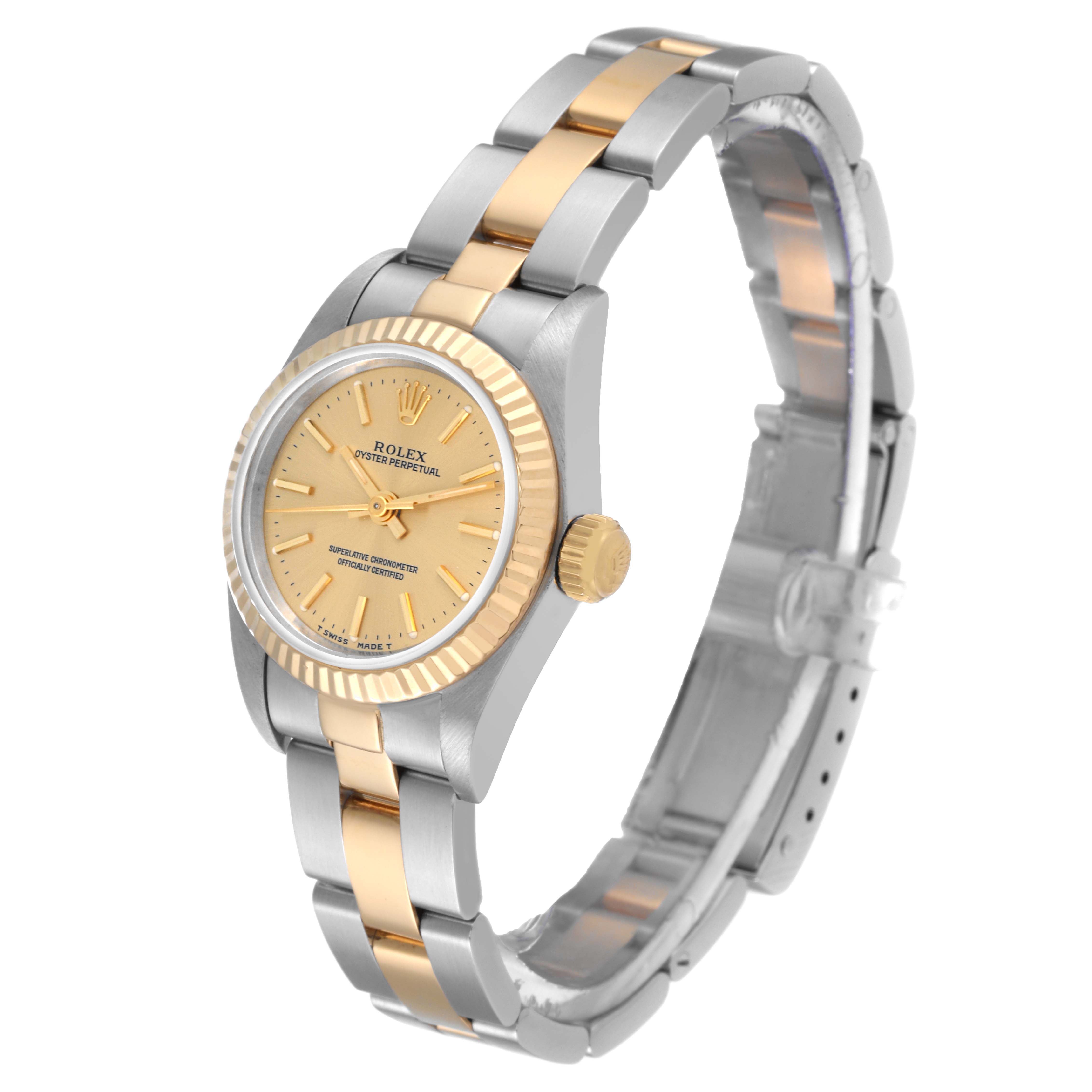 The Rolex Oyster Perpetual 67193 Women's Steel and Gold (two tone) Champagne Dial 67193 Women's Steel and Gold (two tone) Champagne Dial watch is shown at an angle displaying its face, bezel, crown, and two-tone bracelet.