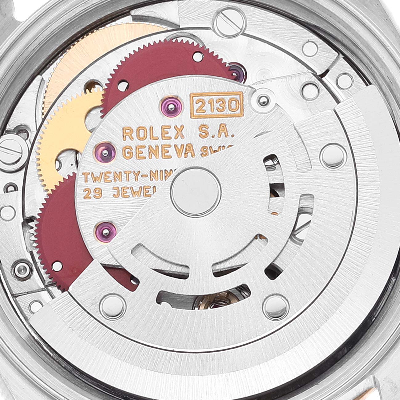 This image shows the inner mechanical movement and components of a Rolex Oyster Perpetual 67193 Women's Steel and Gold (two tone) Champagne Dial 67193 Women's Steel and Gold (two tone) Champagne Dial watch, model 2130.