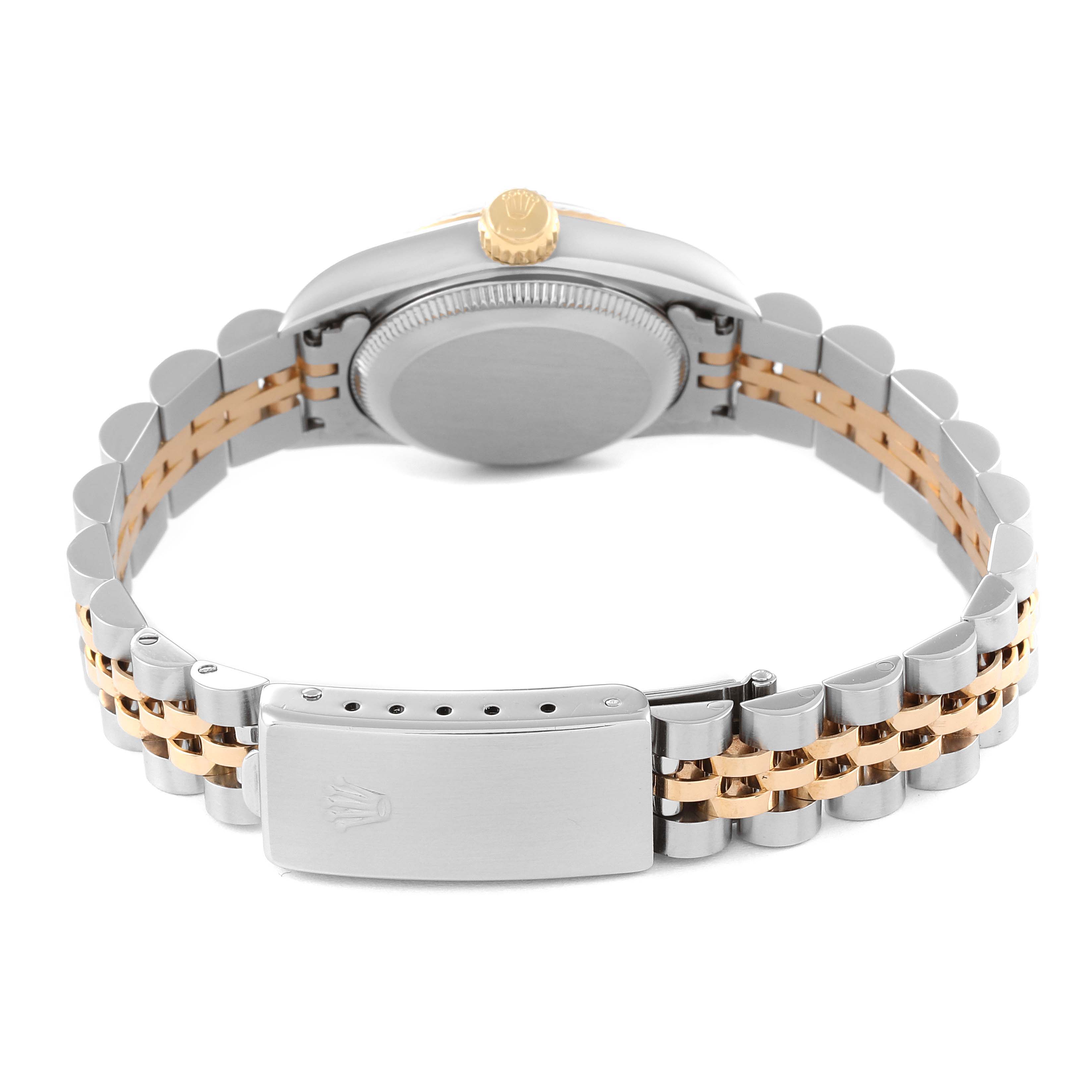 This image shows the back view of a Rolex Oyster Perpetual 67193 Women's Steel and Gold (two tone) Champagne Dial 67193 Women's Steel and Gold (two tone) Champagne Dial watch, focusing on the clasp, case back, and two-tone bracelet.