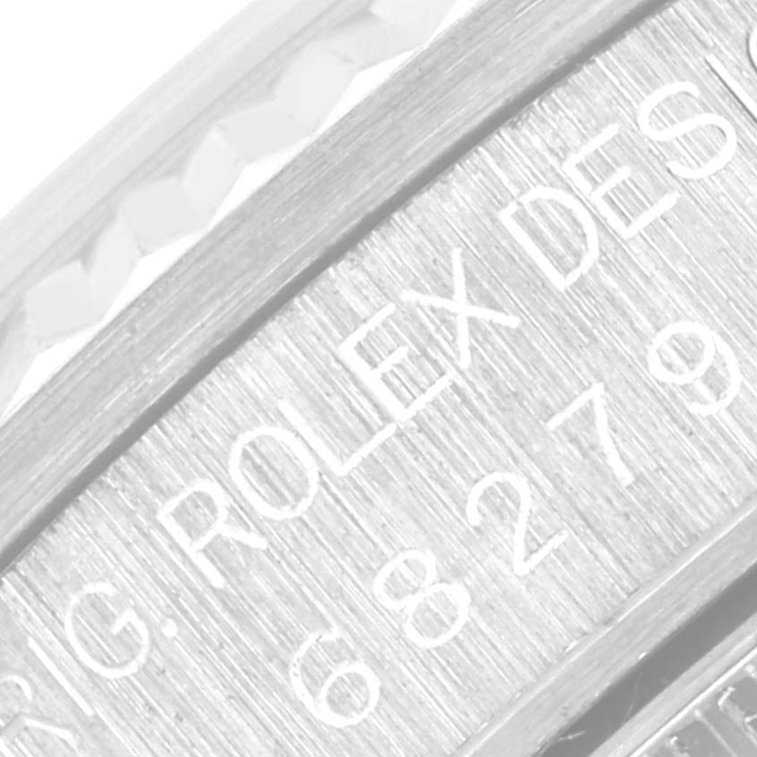 The image shows a close-up of the inner bezel ring of the Rolex President 68279 Women's White Gold Mother of Pearl Dial 68279 Women's White Gold Mother of Pearl Dial watch, displaying engraved text.