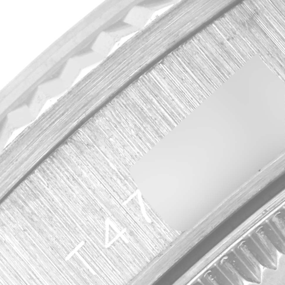 This close-up image shows the date window and part of the bezel of a Rolex President 68279 Women's White Gold Mother of Pearl Dial 68279 Women's White Gold Mother of Pearl Dial model watch.