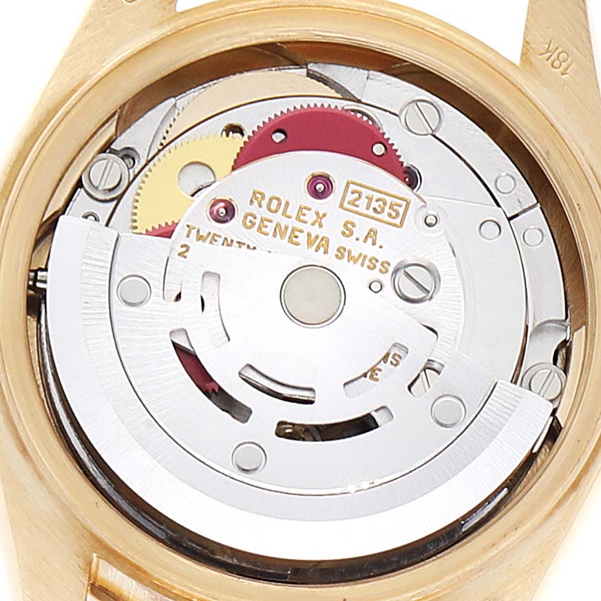 This image shows the internal movement mechanism of a Rolex President 69068 Women
s Yellow Gold Champagne Dial 69068 Women
s Yellow Gold Champagne Dial model watch from a close-up angle.