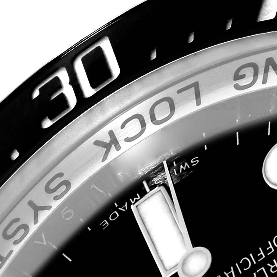 The image shows a close-up of the bezel and part of the dial of the Rolex Sea-Dweller 116660 Men
s Stainless Steel Black Dial 116660 Men
s Stainless Steel Black Dial, focusing on the numbers and text.