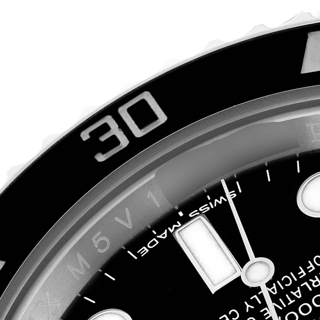 This close-up image of the Rolex Submariner 116610 Men
s Stainless Steel Black Dial 116610 Men
s Stainless Steel Black Dial watch displays the bezel and part of the dial, focusing on the 30-minute mark.