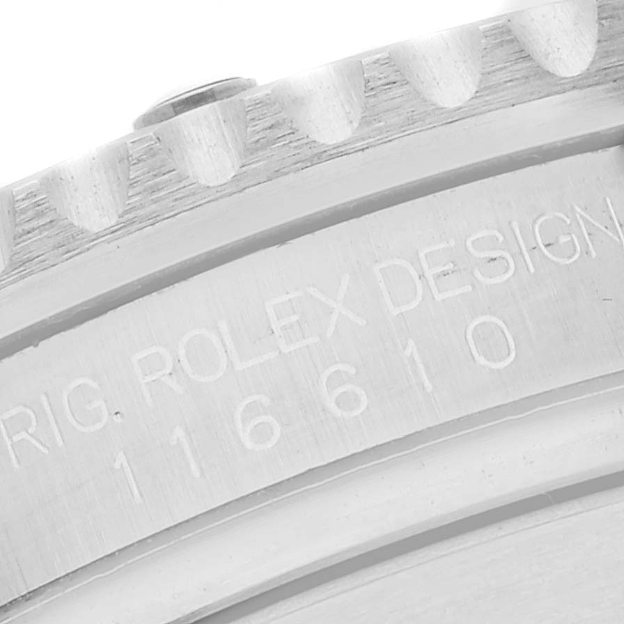 The image shows a close-up of the engraved case back and bezel of a Rolex Submariner 116610 Men
s Stainless Steel Black Dial 116610 Men
s Stainless Steel Black Dial watch, model number 116610.