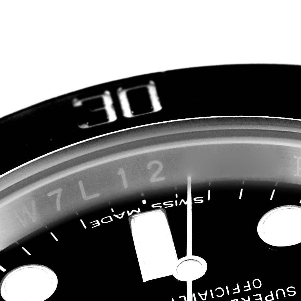 The image shows a close-up of the bezel, dial, and hands of a Rolex Submariner 116610 Men
s Stainless Steel Black Dial 116610 Men
s Stainless Steel Black Dial watch, with "30" on the bezel and partial markers visible.