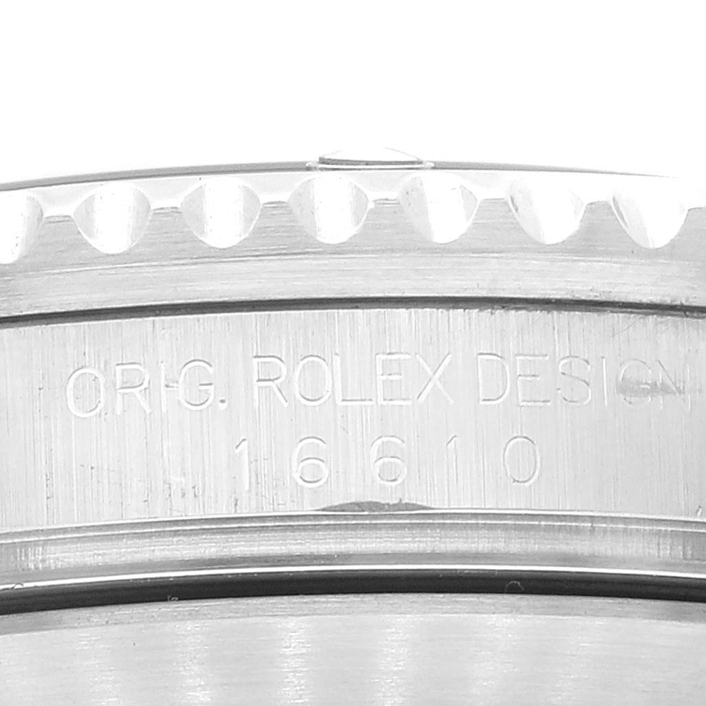 The image shows a close-up of the case side of the Rolex Submariner 16610 Men's Stainless Steel Black Dial 16610 Men's Stainless Steel Black Dial, displaying the engraved model number 16610.