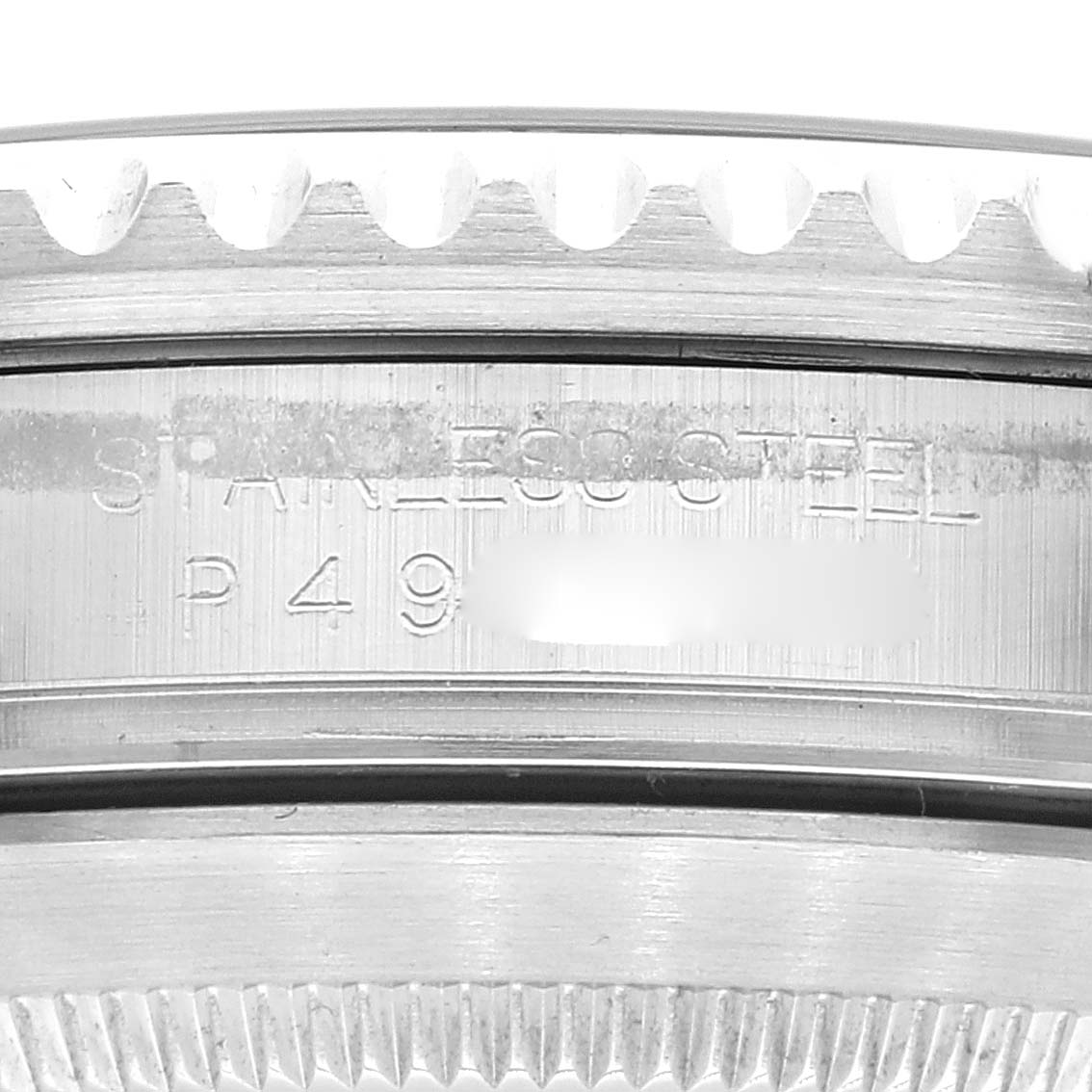 This image shows a close-up of the case side and the engraving of the serial number on a Rolex Submariner 16610 Men
s Stainless Steel Black Dial 16610 Men
s Stainless Steel Black Dial watch.