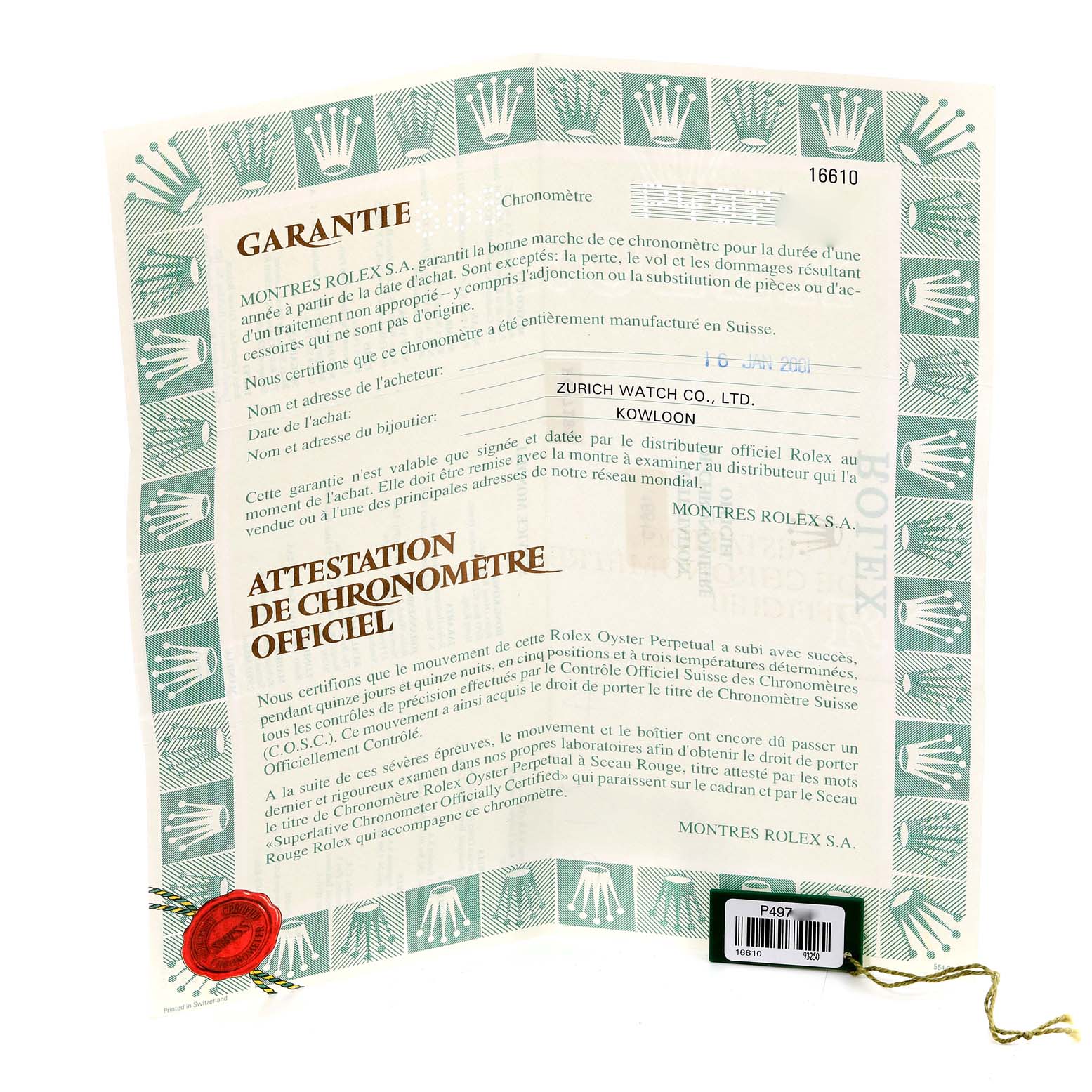 The image shows a folded guarantee certificate and a tag for the Rolex Submariner 16610 Men
s Stainless Steel Black Dial 16610 Men
s Stainless Steel Black Dial model.