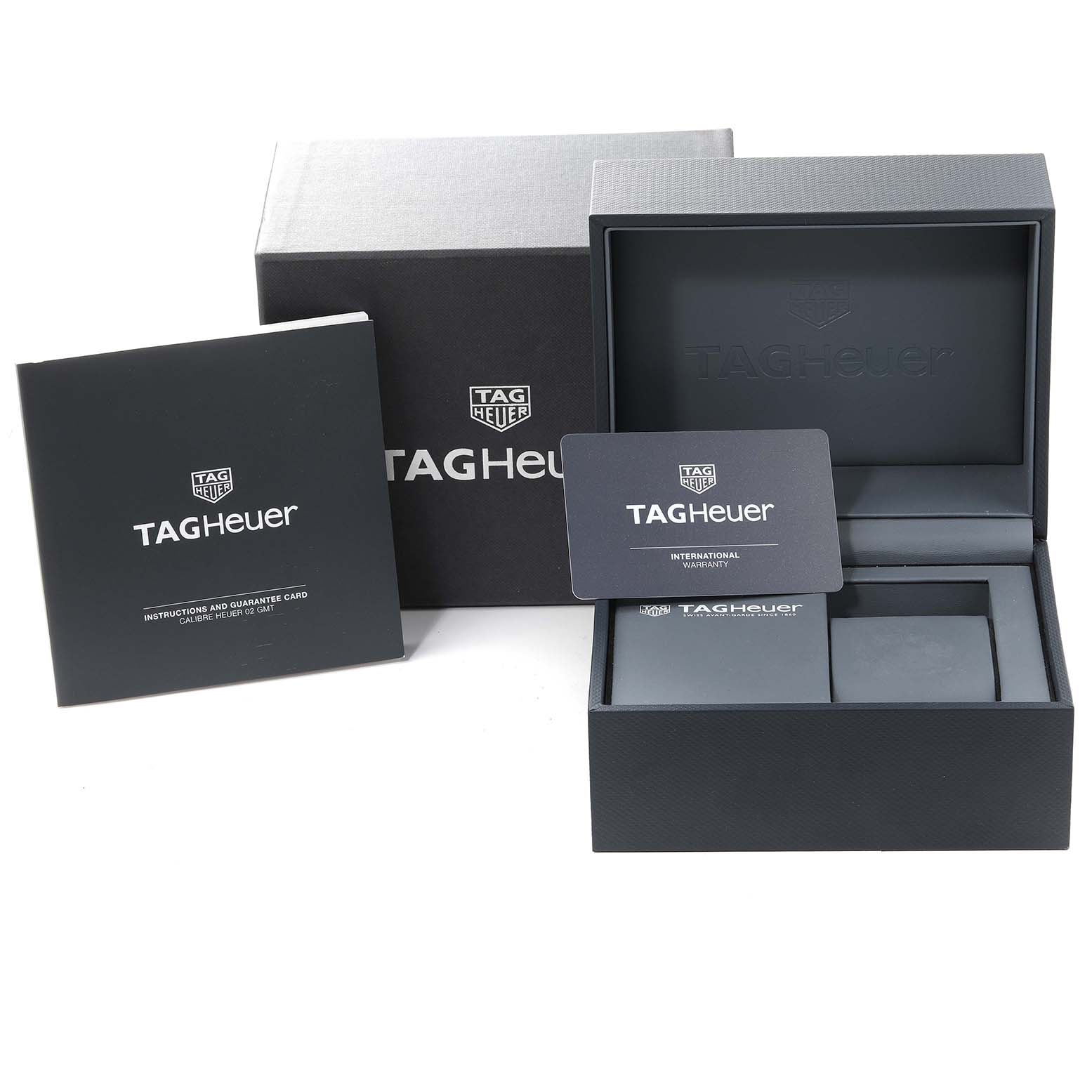 The image shows the packaging and accessories for a Tag Heuer Carrera CBG2A1Z.BA0658 Men's Stainless Steel Black Dial CBG2A1Z.BA0658 Men's Stainless Steel Black Dial watch, including the box, instructions, and warranty card.