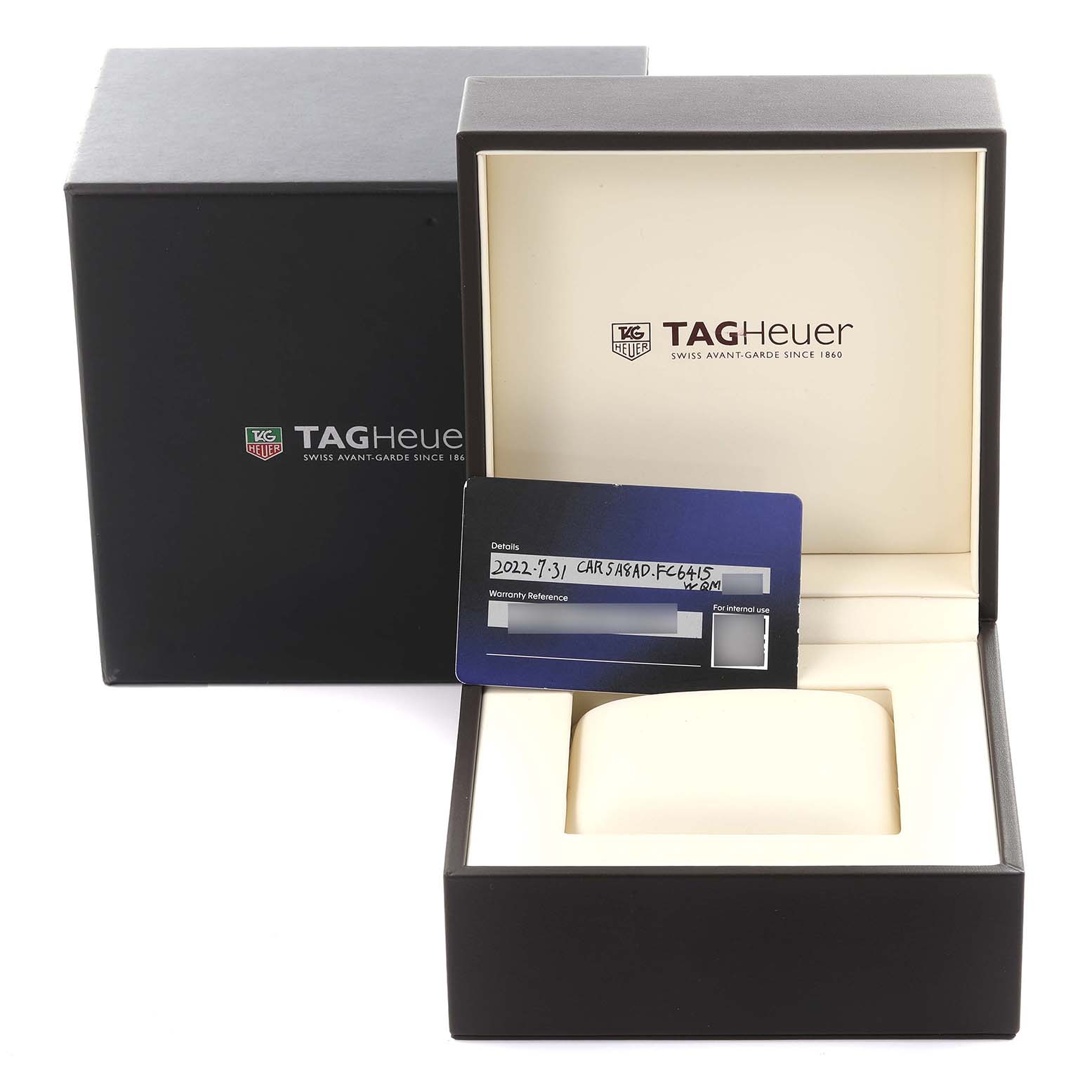 The image shows a Tag Heuer Carrera CAR5A8AD Mens Titanium Black Dial watch box and warranty card at a slight angle.