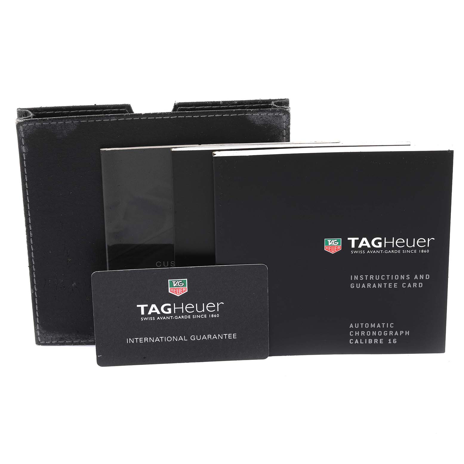 The image shows the box, instruction manual, and international guarantee card for the Tag Heuer Carrera CV2050.BD0789 Men's Steel and Gold (two tone) Silver Dial CV2050.BD0789 Men's Steel and Gold (two tone) Silver Dial watch.