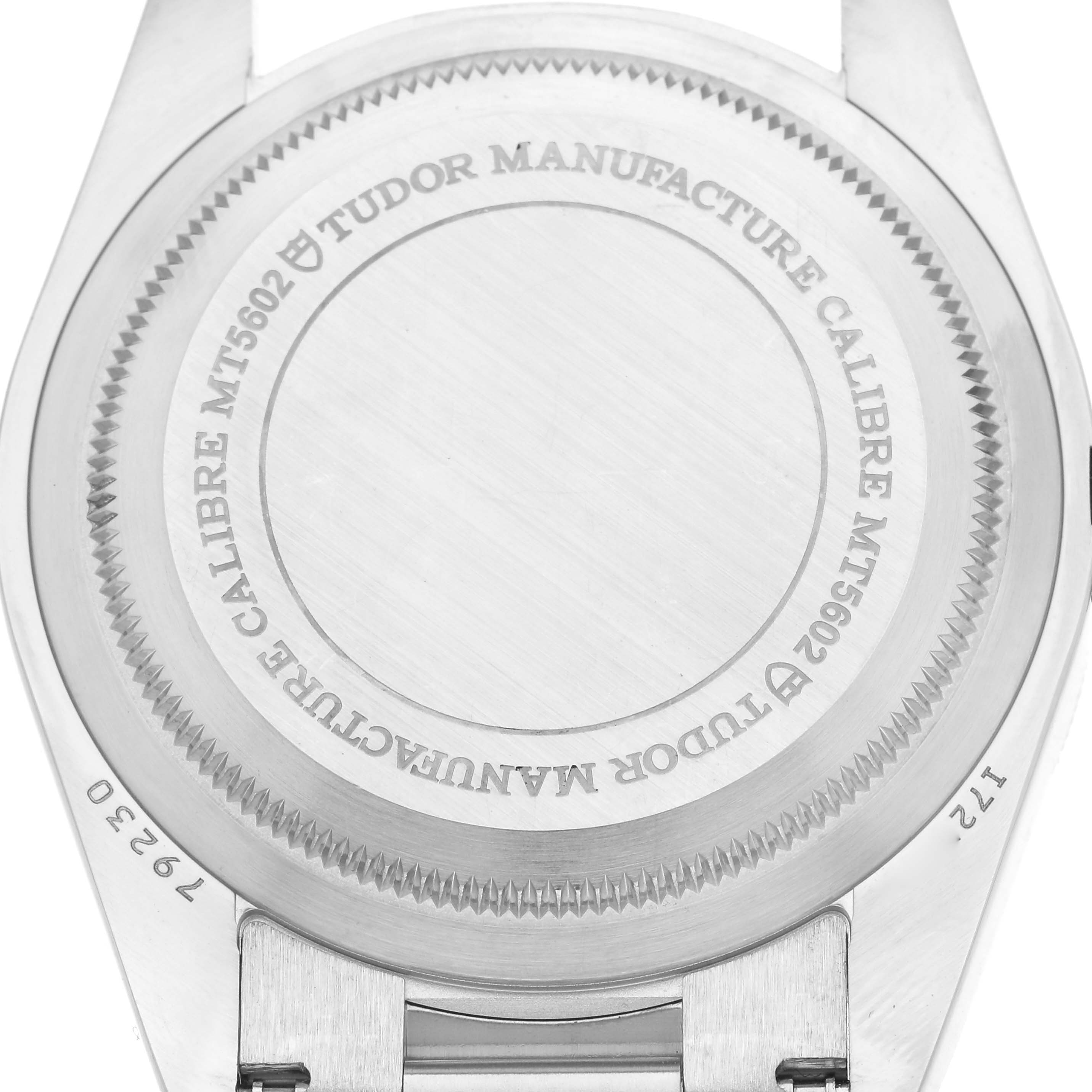 The image shows the back casing of the Tudor Heritage Black Bay M79230N-0002 Men
s Stainless Steel Black Dial M79230N-0002 Men
s Stainless Steel Black Dial watch, highlighting the engraved details and caliber information.