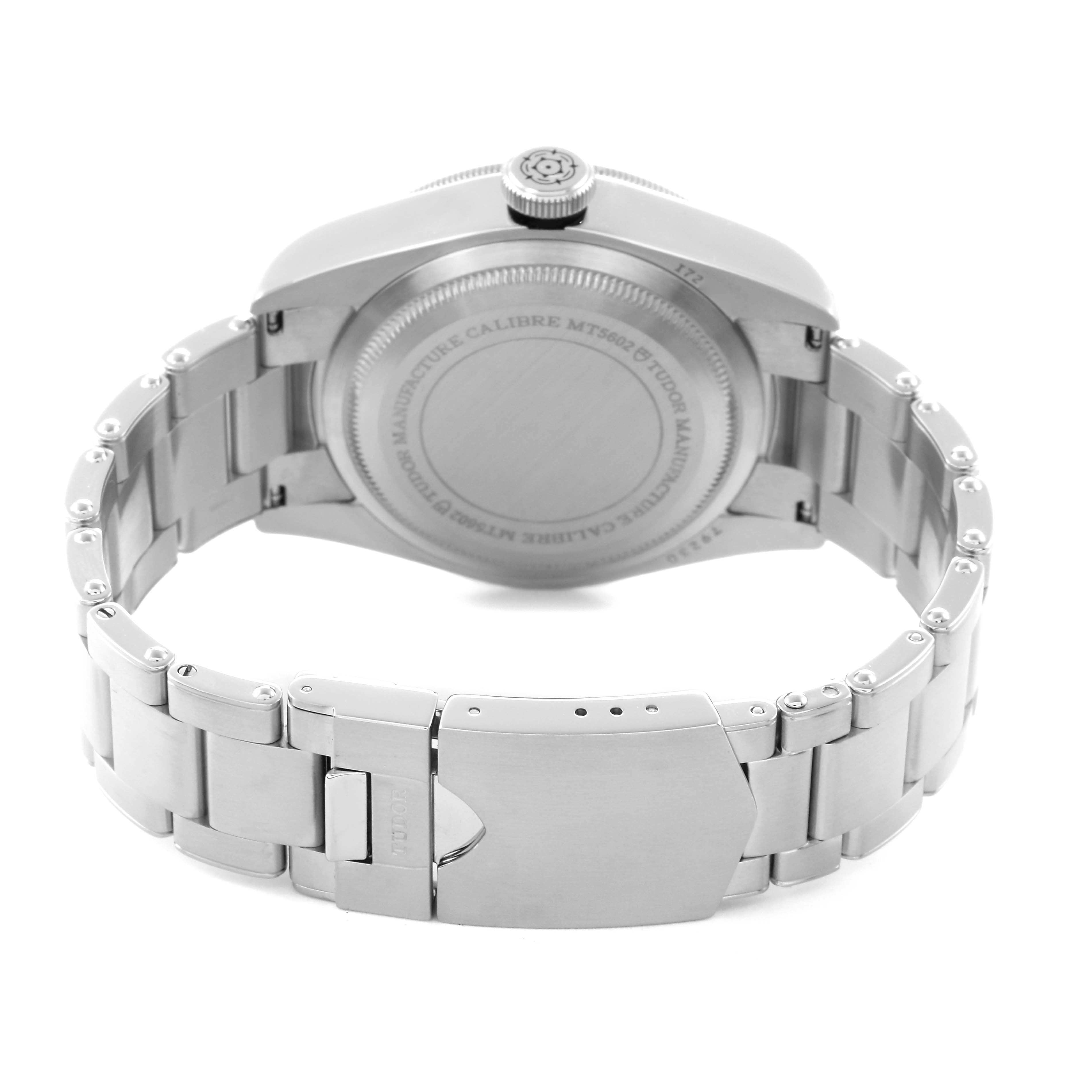 The image shows the back view of the Tudor Heritage Black Bay M79230N-0002 Men
s Stainless Steel Black Dial M79230N-0002 Men
s Stainless Steel Black Dial, focusing on its case back and bracelet clasp.