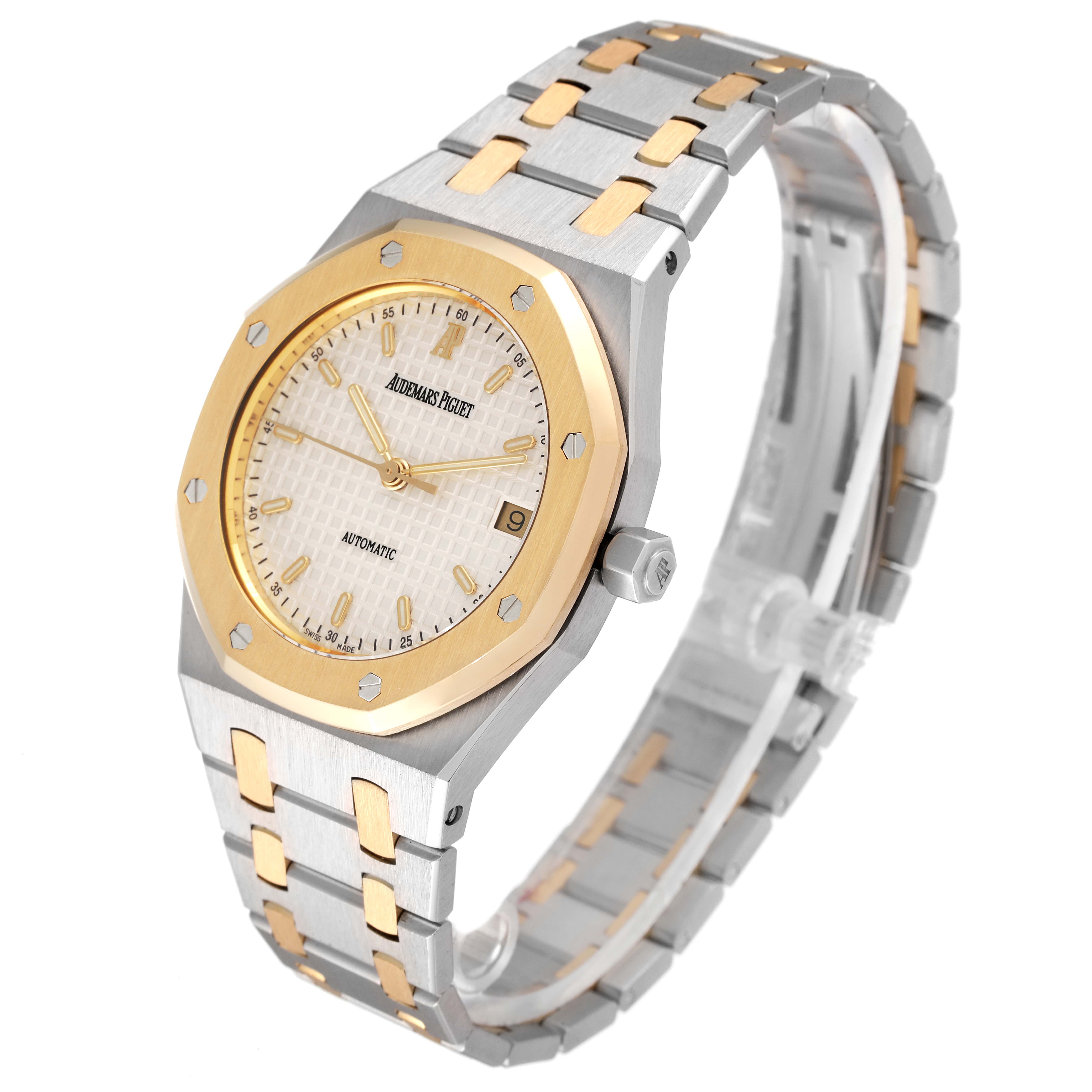 The Audemars Piguet Royal Oak 14790SA.OO.0789SA.08 Men's Steel and Gold (two tone) Silver Dial 14790SA.OO.0789SA.08 Men's Steel and Gold (two tone) Silver Dial watch is shown at a three-quarter angle, displaying the face, bezel, crown, and a part of the bracelet.
