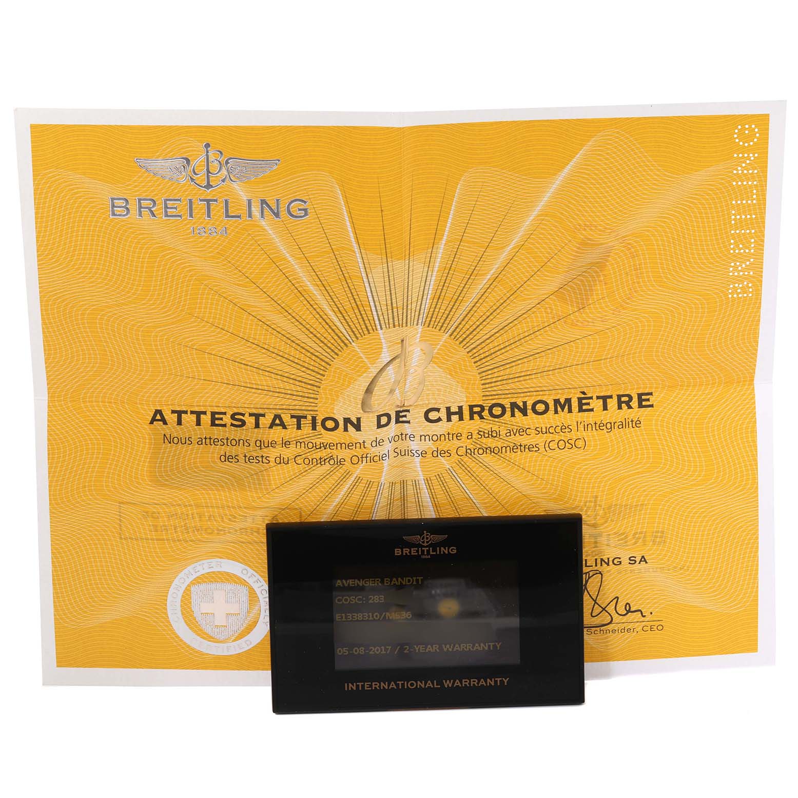 The image shows the warranty card and chronometer certificate for a Breitling Avenger E13383 Men's Titanium Grey Dial E13383 Men's Titanium Grey Dial model watch.