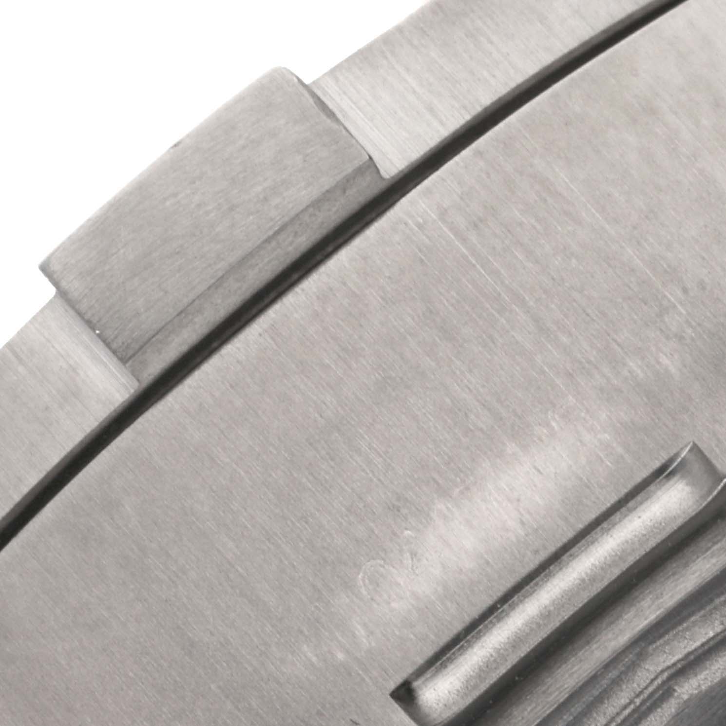 Close-up of the bezel of the Breitling Avenger E13383 Men's Titanium Grey Dial E13383 Men's Titanium Grey Dial watch, showing the brushed metal finish and part of the bezel rider tabs.