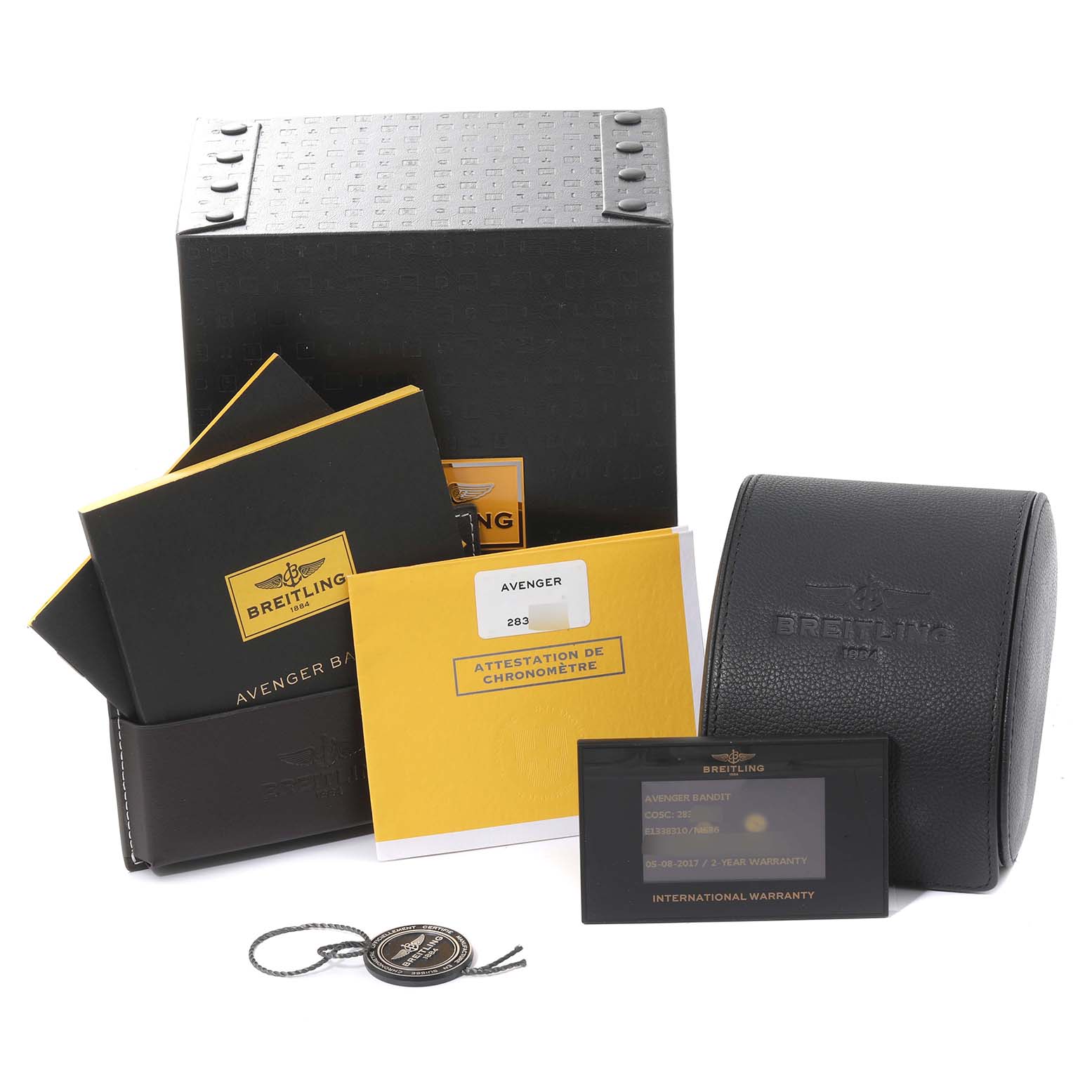 The image shows the packaging, instruction manuals, warranty card, and watch case for the Breitling Avenger E13383 Men's Titanium Grey Dial E13383 Men's Titanium Grey Dial model.