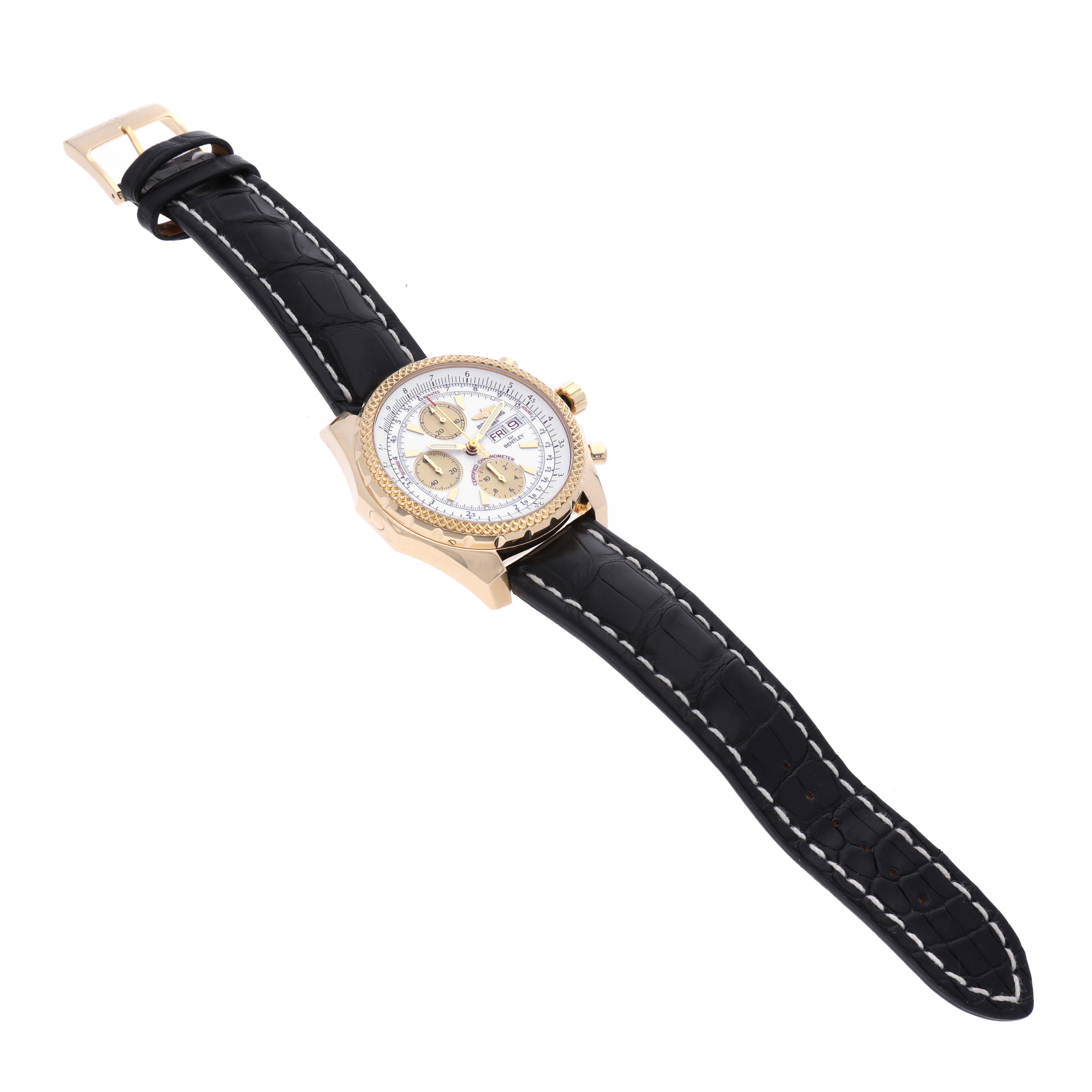 This Breitling Bentley K13362 Men
s Yellow Gold White Dial K13362 Men
s Yellow Gold White Dial watch is shown at an angle highlighting the full black leather strap, gold case, and dial with subdials.