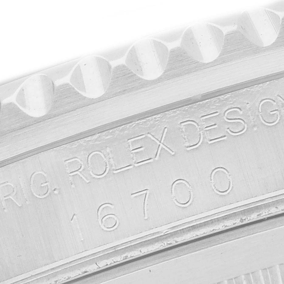 The image shows a close-up of the engraving on the side of a Rolex GMT-Master 16700 Men
s Stainless Steel Black Dial 16700 Men
s Stainless Steel Black Dial, including the model number 16700.