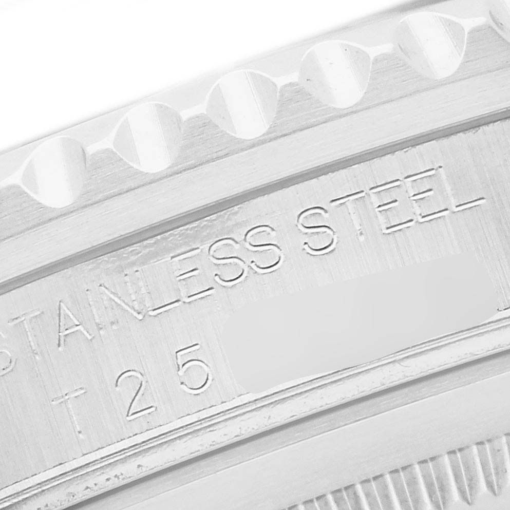 The image shows a close-up of the bezel and edge of the case back on a Rolex GMT-Master 16700 Men
s Stainless Steel Black Dial 16700 Men
s Stainless Steel Black Dial, with "STAINLESS STEEL" engraving.