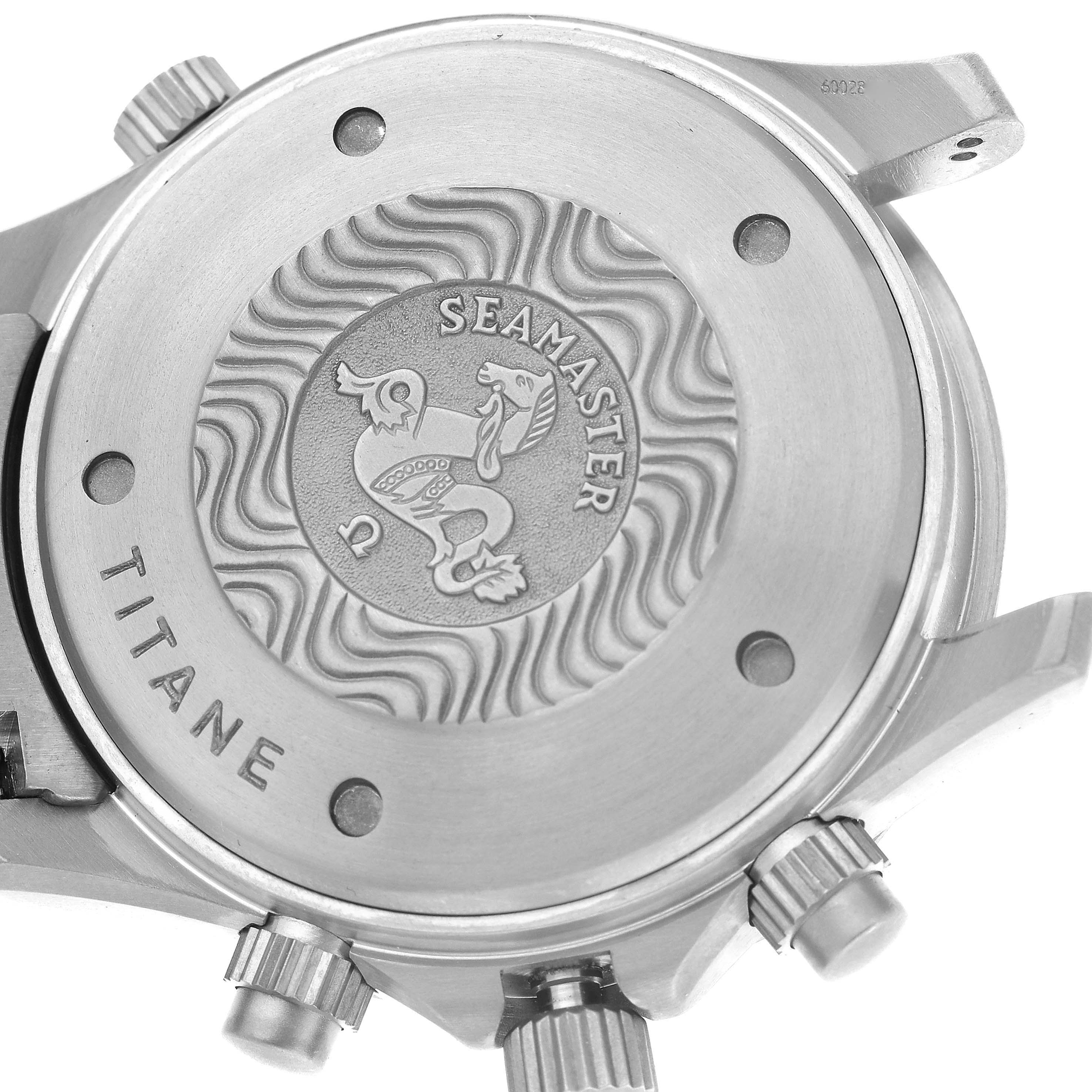 The image shows the back case of an Omega Seamaster 2298.80.00 Men's Titanium Blue Dial 2298.80.00 Men's Titanium Blue Dial watch, highlighting the engravings and crown parts.