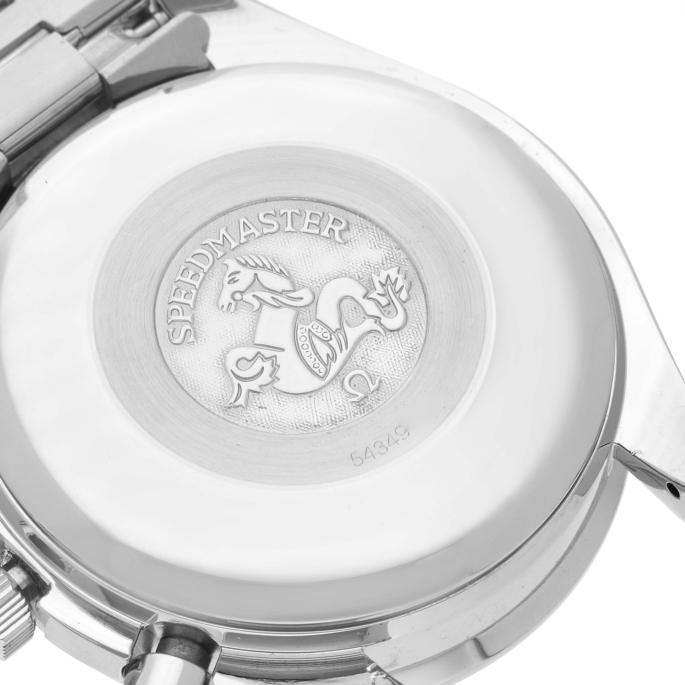 This image shows the back case of an Omega Speedmaster watch with the engraved emblem in focus.