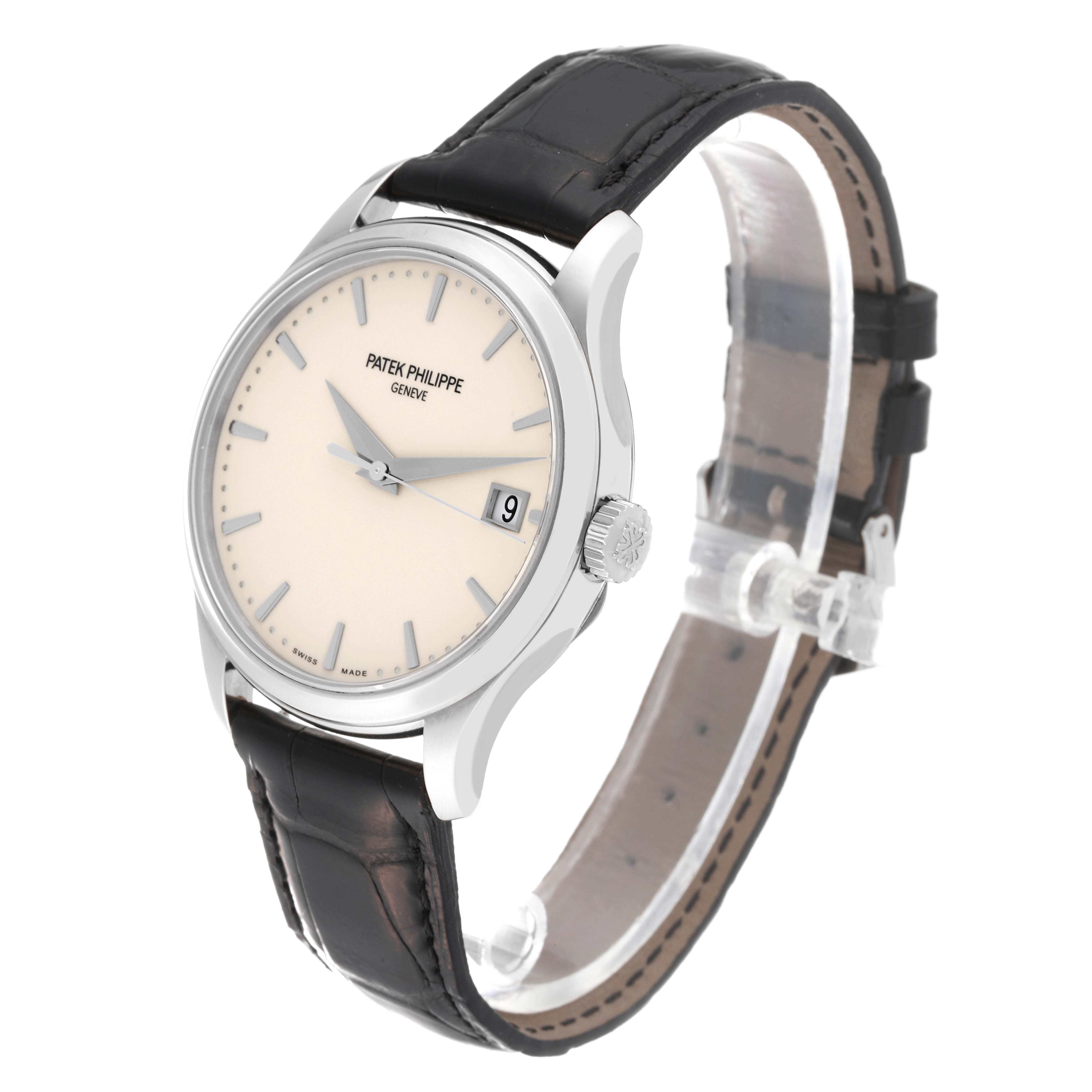 This image shows a Patek Philippe Calatrava 5227G-001 Men's White Gold Beige Dial 5227G-001 Men's White Gold Beige Dial watch at an angled view highlighting the face, crown, and leather strap.