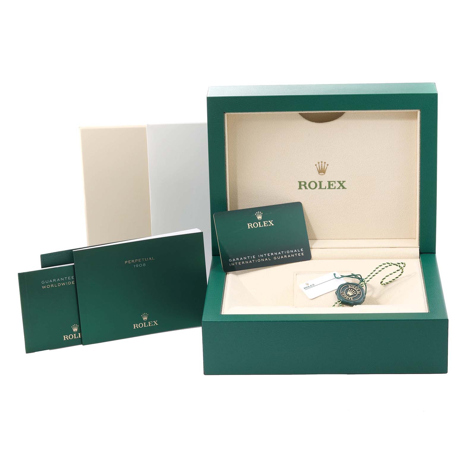 The image shows the packaging and accessories for a Rolex Cellini watch, including the box, booklets, and a tag.