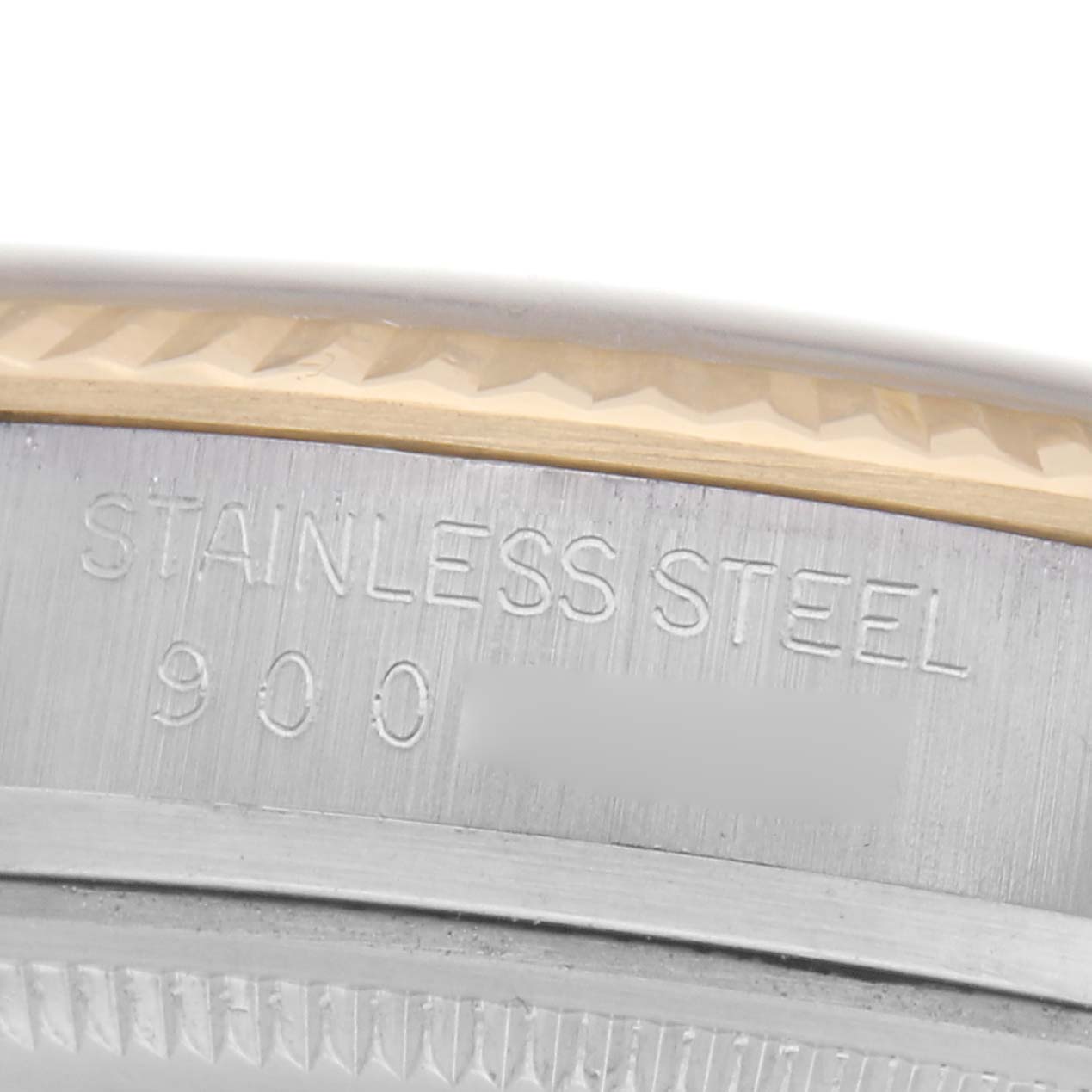 The image shows a close-up of the stainless steel side engraving on a Rolex Vintage Collection 16013 Men
s Steel and Gold (two tone) Champagne Dial 16013 Men
s Steel and Gold (two tone) Champagne Dial watch.