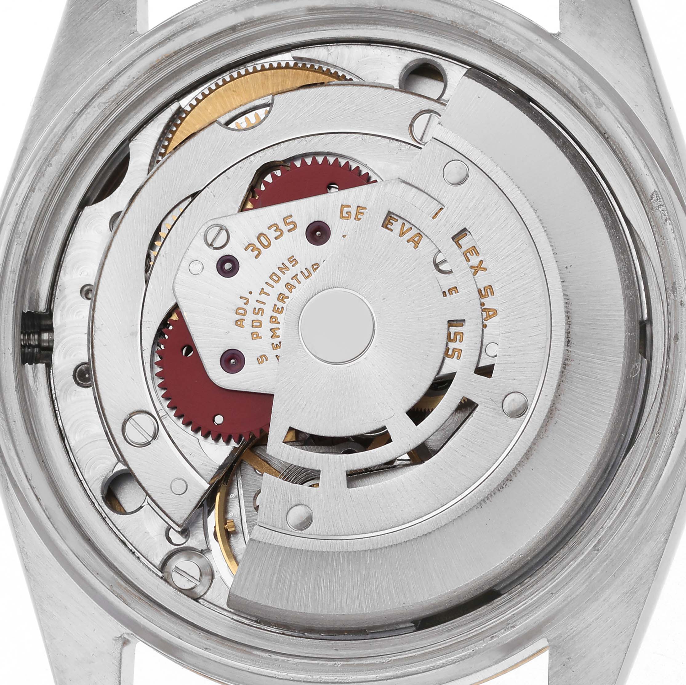 The image shows the movement of the Rolex Vintage Collection 16013 Men
s Steel and Gold (two tone) Champagne Dial 16013 Men
s Steel and Gold (two tone) Champagne Dial watch from a back angle, highlighting gears and mechanical components.