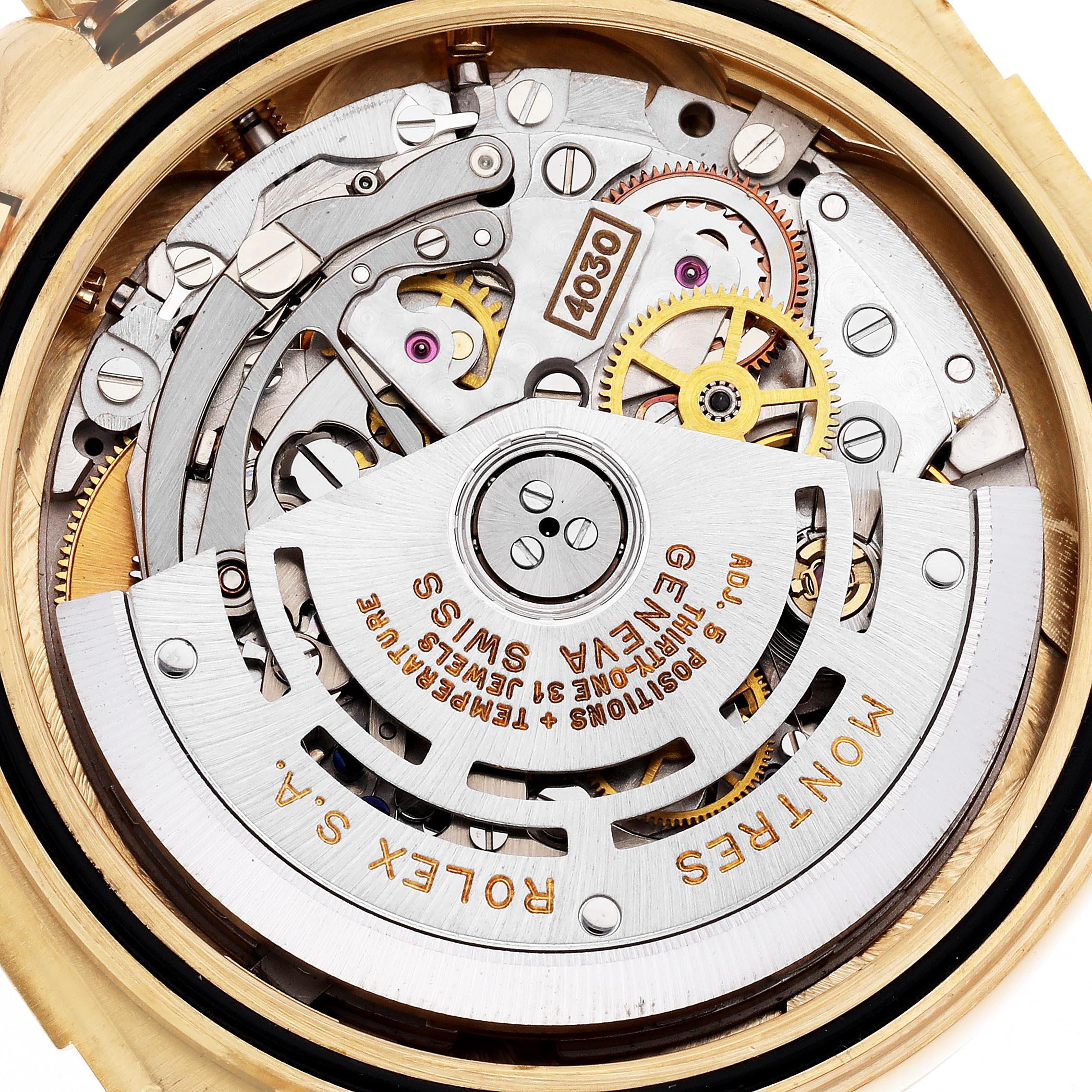 The image shows the back view of a Rolex Daytona 16518 Men
s Yellow Gold White Dial 16518 Men
s Yellow Gold White Dial, highlighting the movement and internal mechanics.