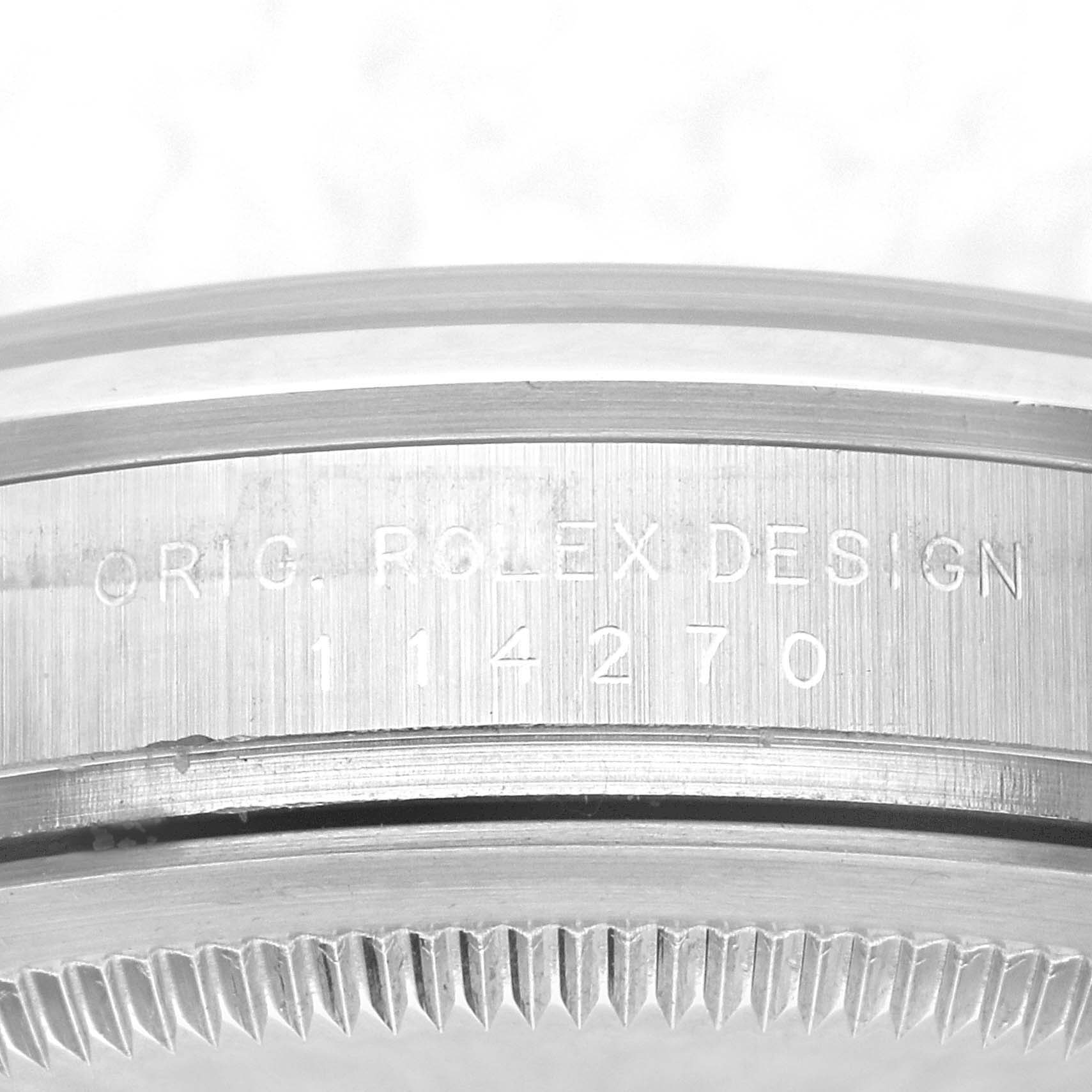 This is a close-up of the case and bezel of a Rolex Explorer 114270 Men's Stainless Steel Black Dial 114270 Men's Stainless Steel Black Dial watch, showing the engraved model number 114270.