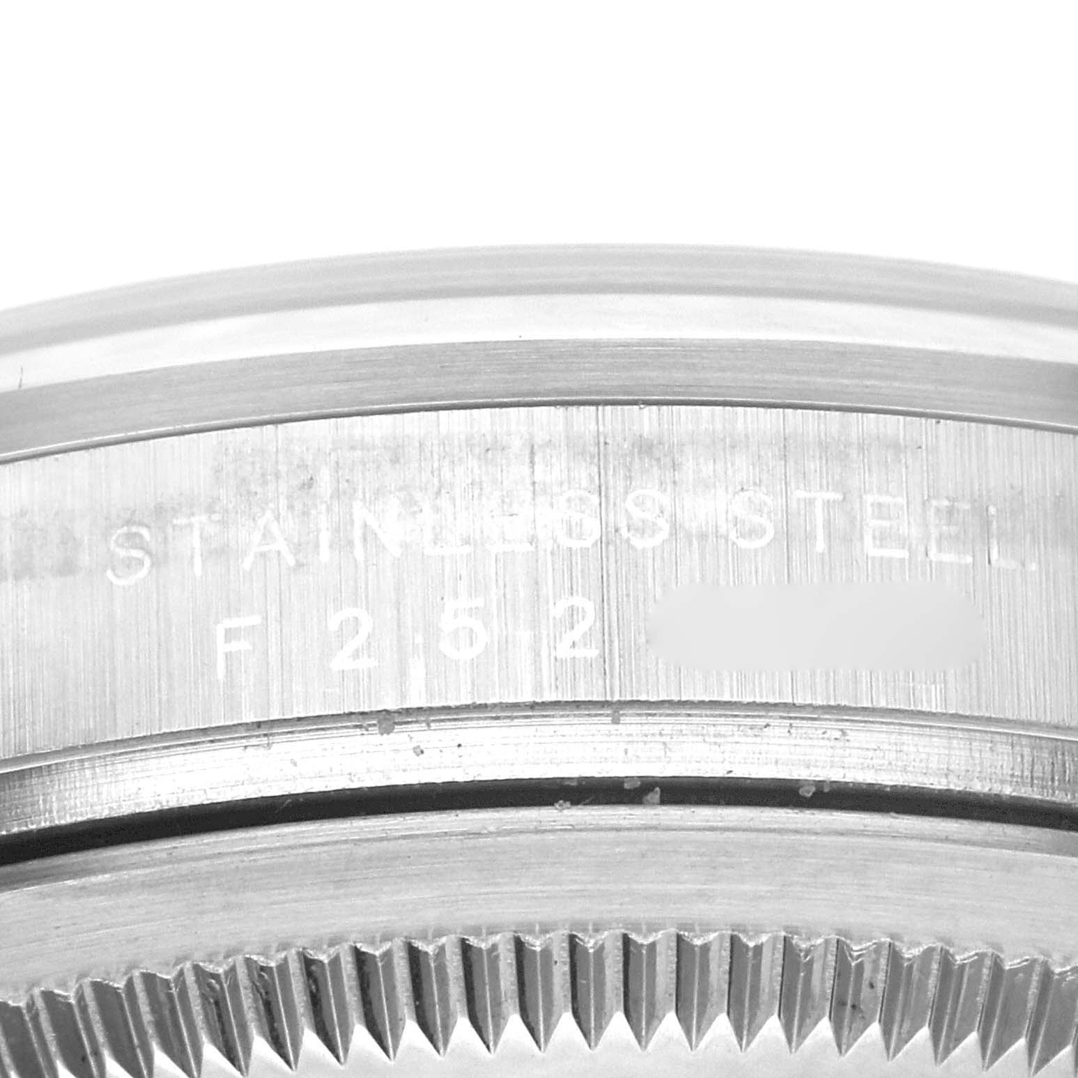 This image shows a close-up of the side engravings and bezel of a Rolex Explorer 114270 Men's Stainless Steel Black Dial 114270 Men's Stainless Steel Black Dial watch.