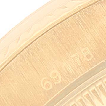 The image shows a close-up of the bezel and case edge of a Rolex President 69178 Women
s Yellow Gold Champagne Dial 69178 Women
s Yellow Gold Champagne Dial model watch.
