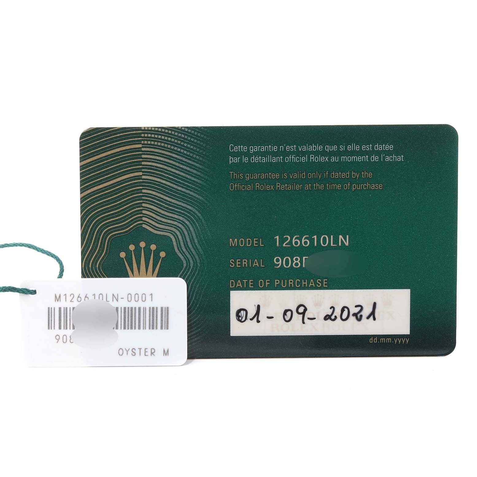 The image shows the warranty card and tag of a Rolex Submariner 126610LN Men
s Stainless Steel Black Dial 126610LN Men
s Stainless Steel Black Dial model 126610LN.