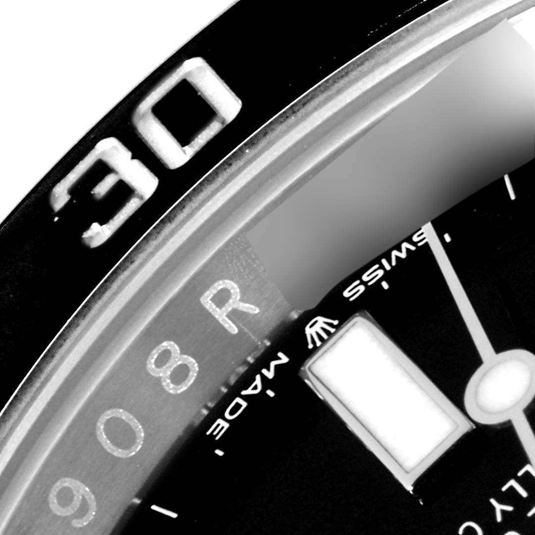 The image shows a close-up of the bezel and part of the dial of a Rolex Submariner 126610LN Men
s Stainless Steel Black Dial 126610LN Men
s Stainless Steel Black Dial watch, featuring the number "30" and "SWISS MADE" text.
