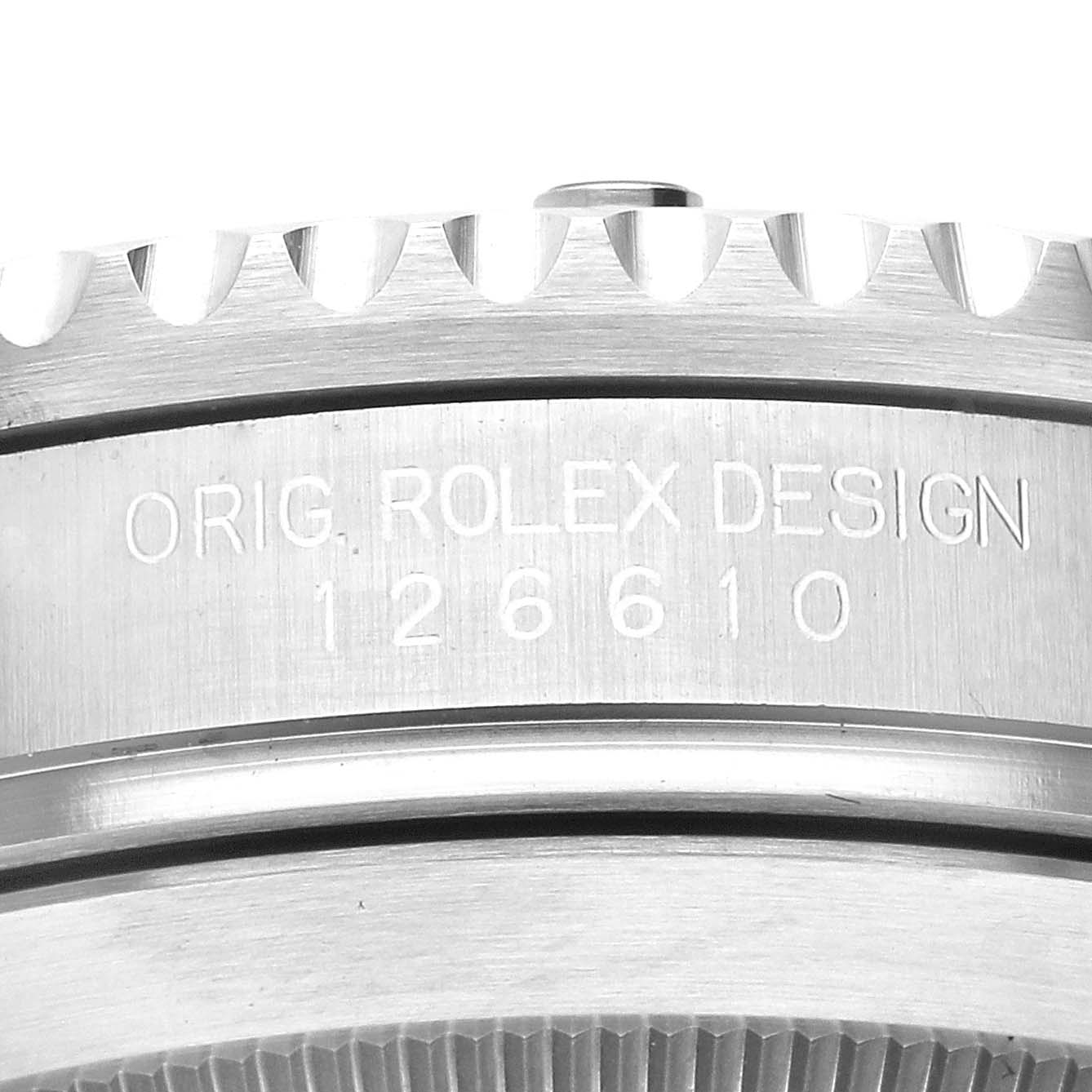 The image shows a close-up of the engraved side of a Rolex Submariner 126610LN Men's Stainless Steel Black Dial 126610LN Men's Stainless Steel Black Dial model, displaying the "ORIG. ROLEX DESIGN" and the model number "126610".