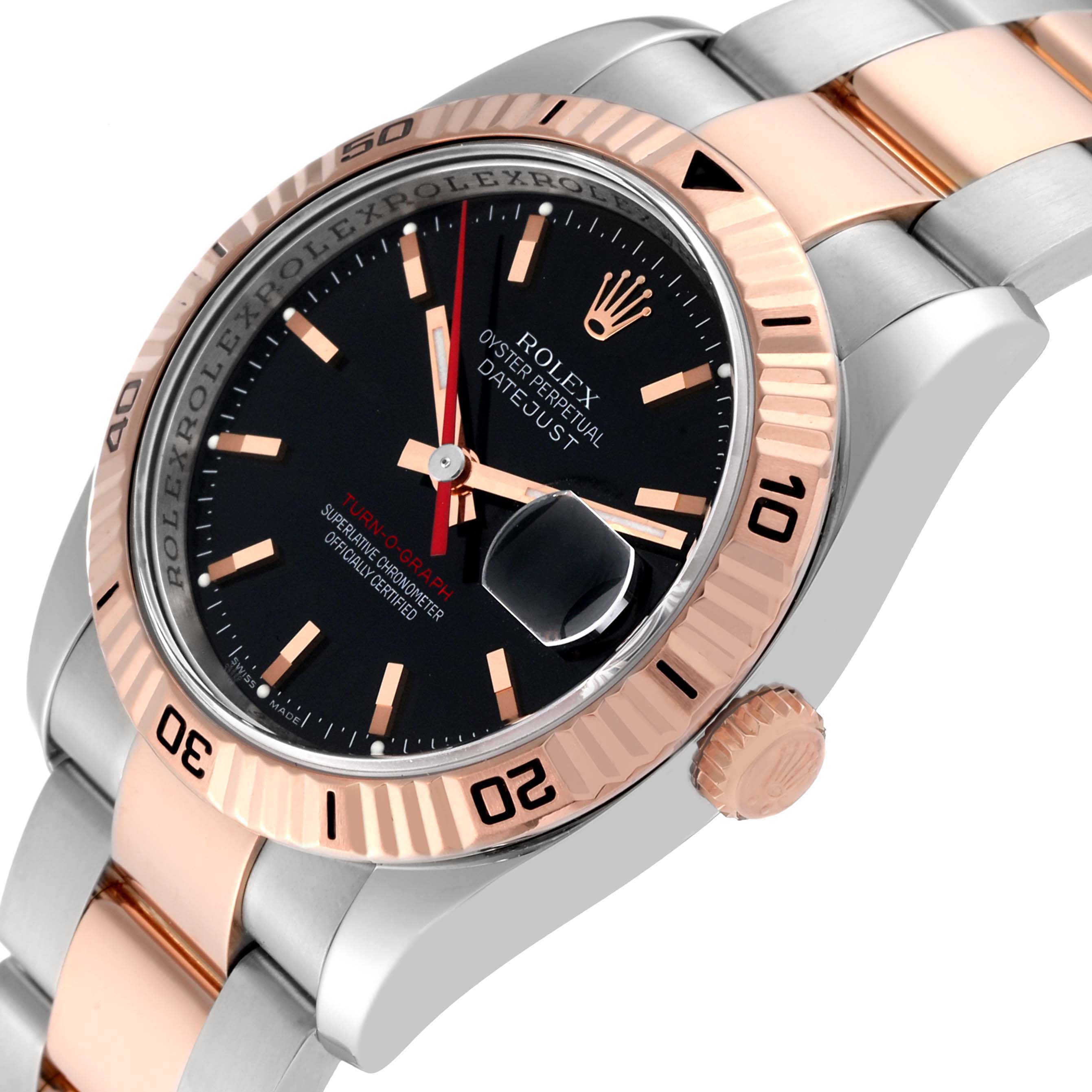This image shows a close-up of a Rolex Turn-o-Graph 116261 Men's Steel and Gold (two tone) Black Dial 116261 Men's Steel and Gold (two tone) Black Dial watch, highlighting its face, bezel, and part of the bracelet.