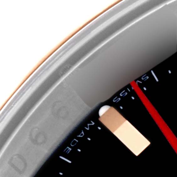 This image shows a close-up of the dial and bezel edge of a Rolex Turn-o-Graph 116261 Men's Steel and Gold (two tone) Black Dial 116261 Men's Steel and Gold (two tone) Black Dial watch at an oblique angle.