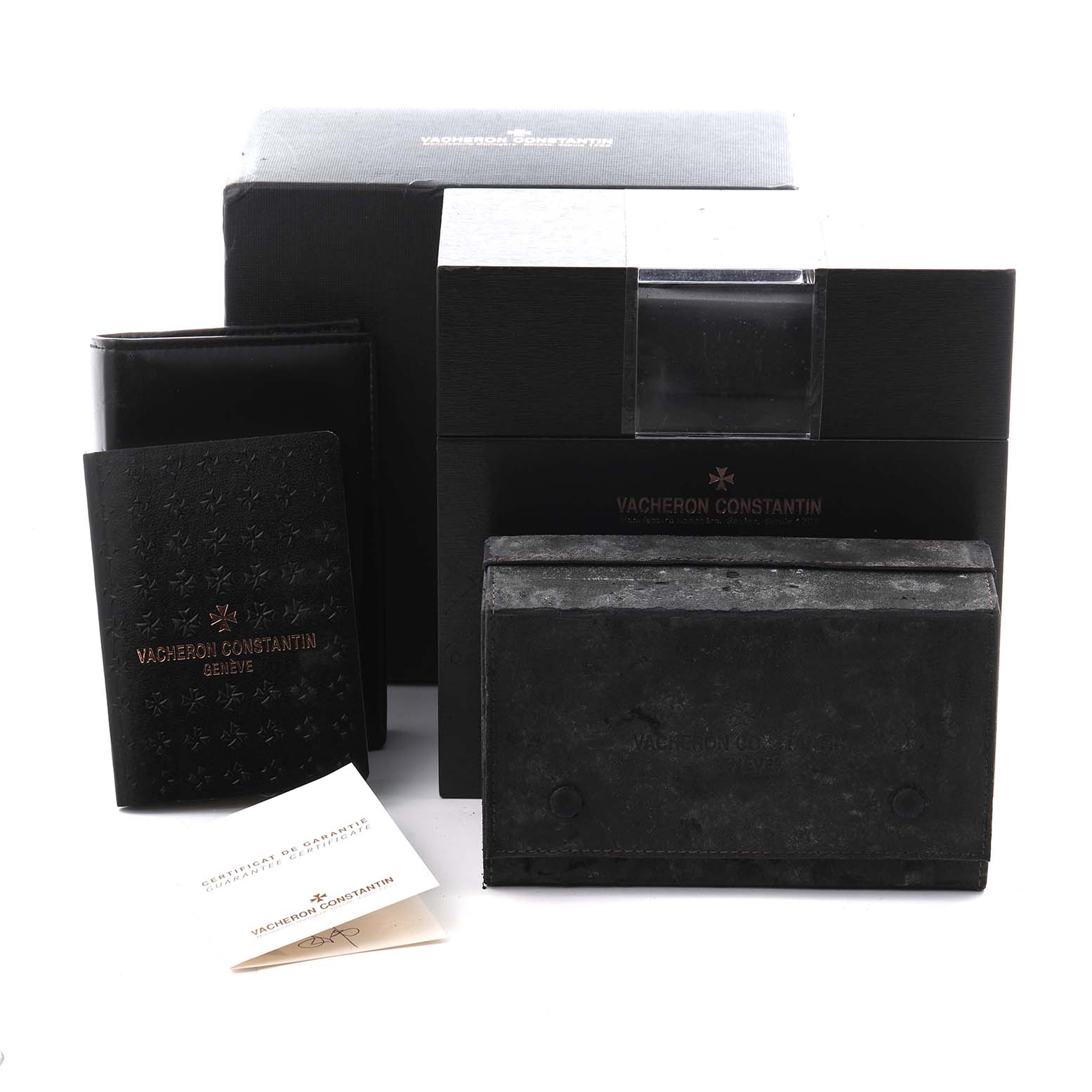 The image shows the packaging and accessories for the Vacheron Constantin Patrimony 85180 Men
s White Gold Silver Dial 85180 Men
s White Gold Silver Dial model, including boxes and booklets.
