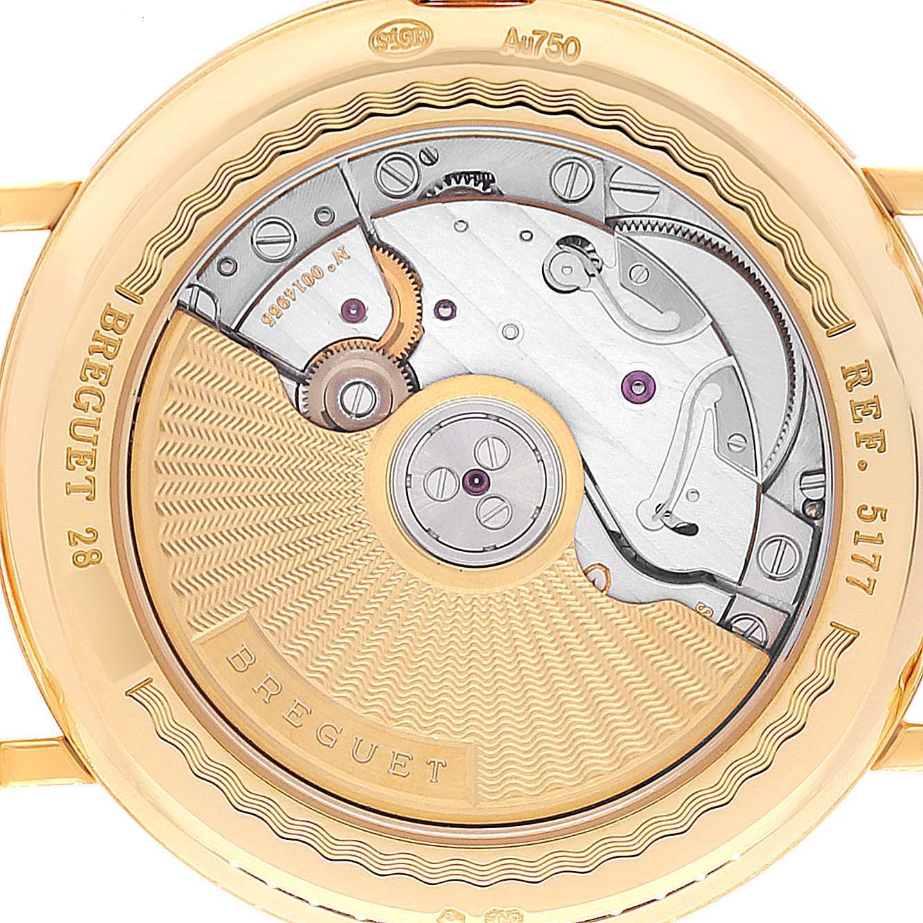 This image shows the back view of the Breguet Classique 5177BA Men's Yellow Gold Silver Dial 5177BA Men's Yellow Gold Silver Dial model, revealing its intricate mechanical movement.