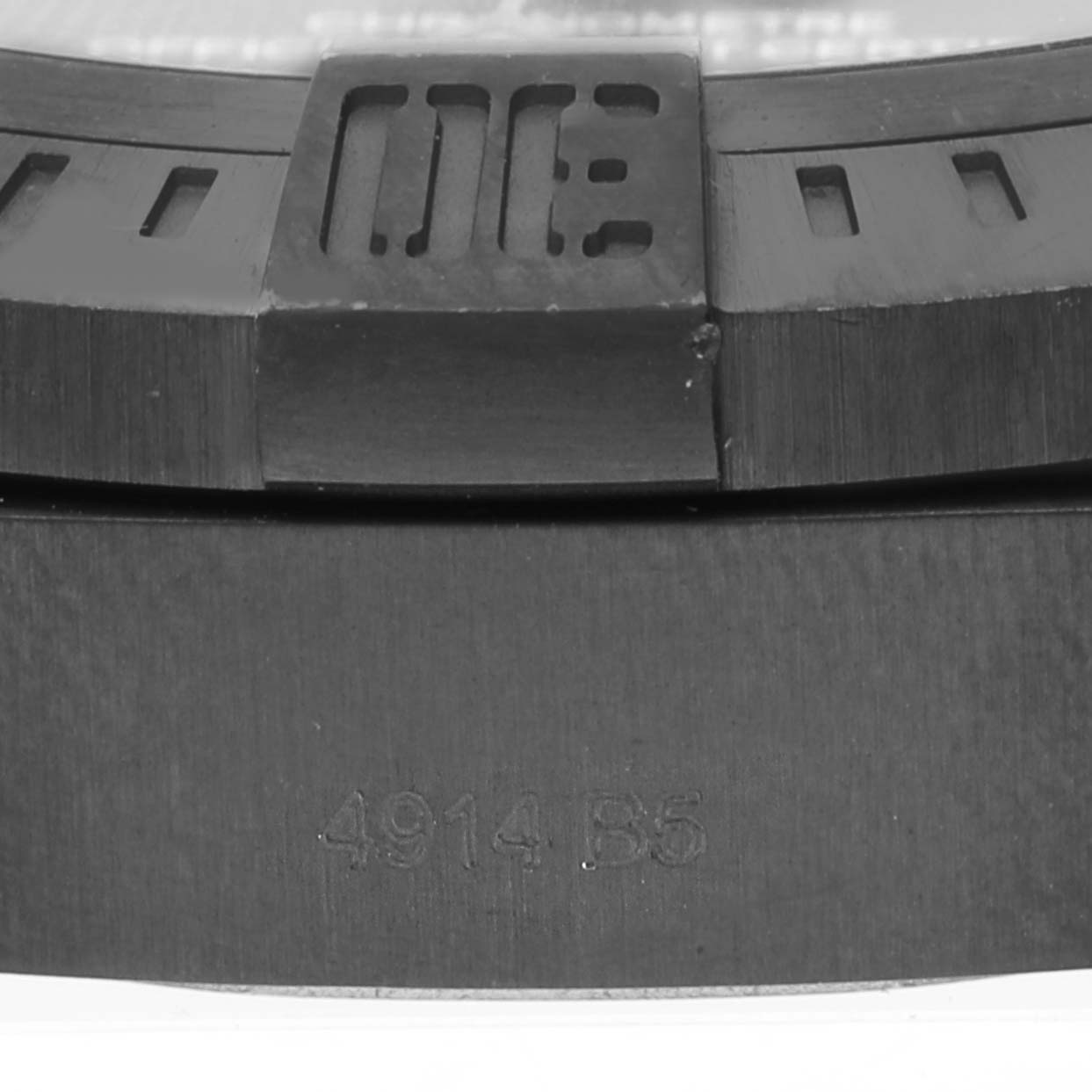 Close-up of the Breitling Avenger V17310 Men's Titanium Black Dial V17310 Men's Titanium Black Dial watch showing part of the bezel and a section with engraving.