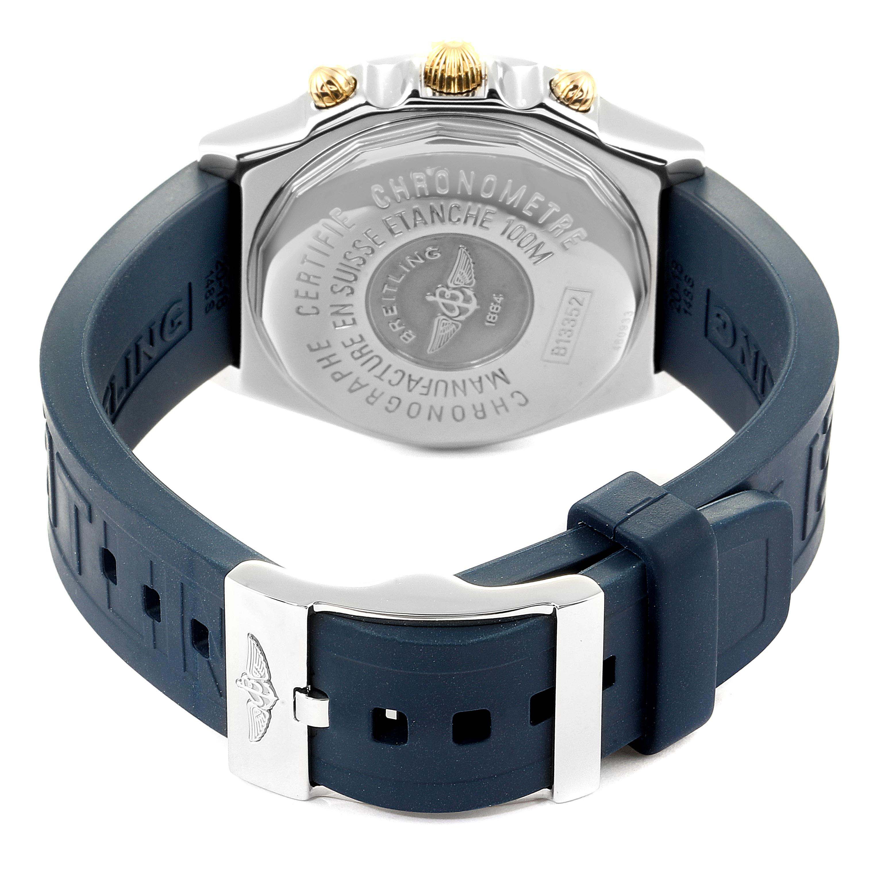 This Breitling Chronomat B13352 Men's Steel and Gold (two tone) White Dial B13352 Men's Steel and Gold (two tone) White Dial watch is displayed from the back, showing the caseback and part of the blue rubber strap.